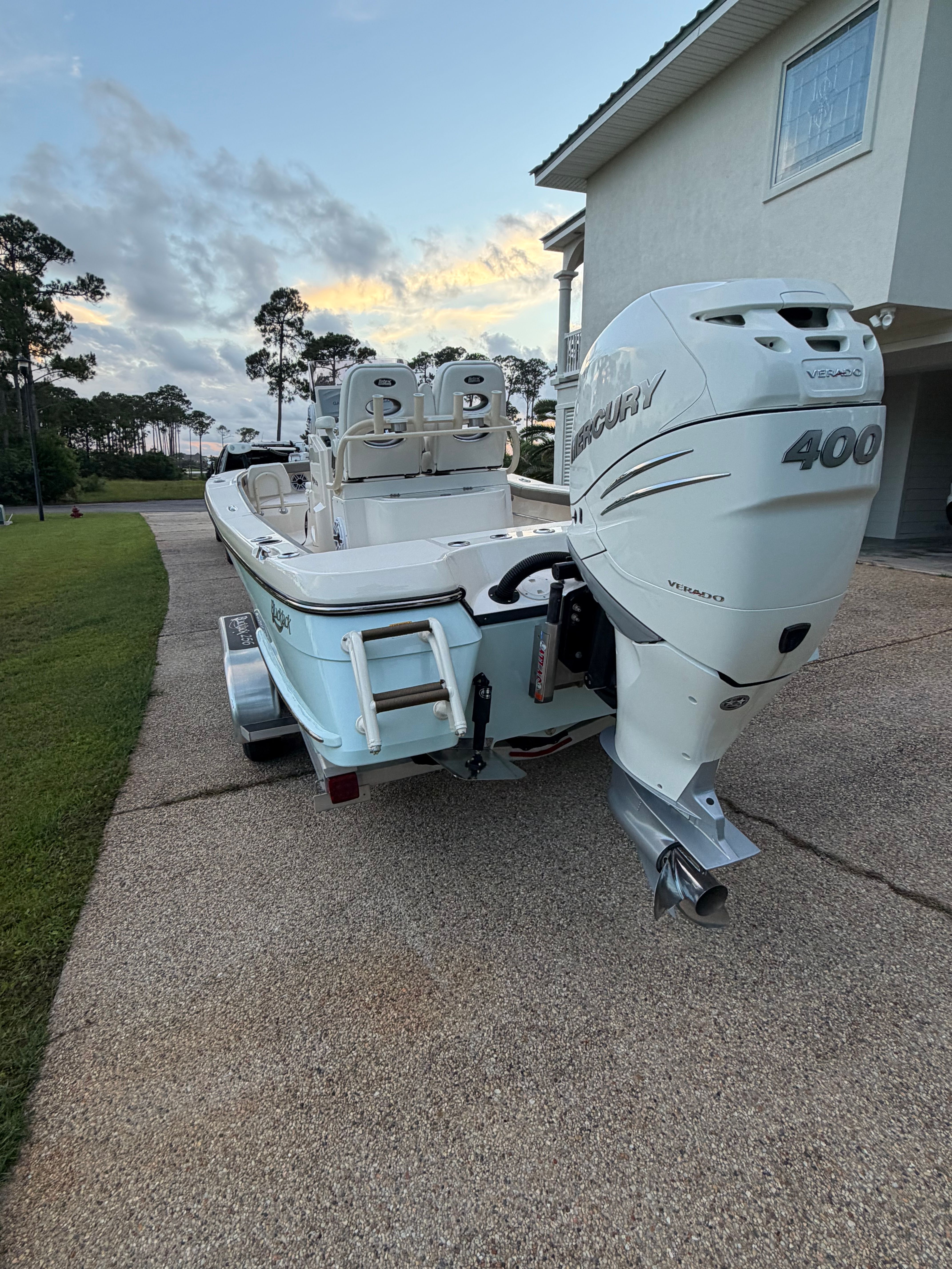 2022 BlackJack 256 Coastal boat with Mercury 400 engine on trailer.