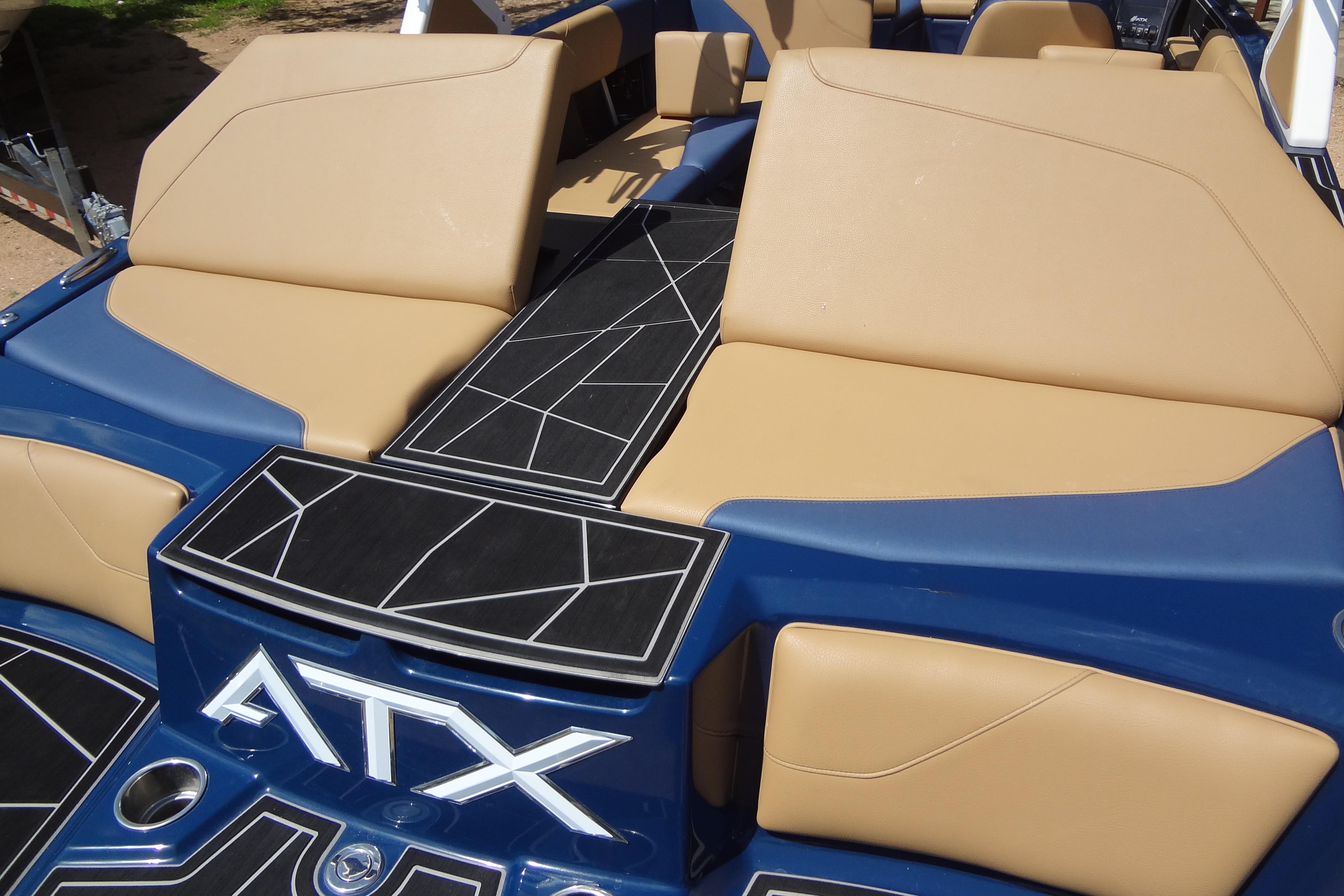 2022 ATX Surf Boats 24 Type-S interior with tan seating and geometric black accents.