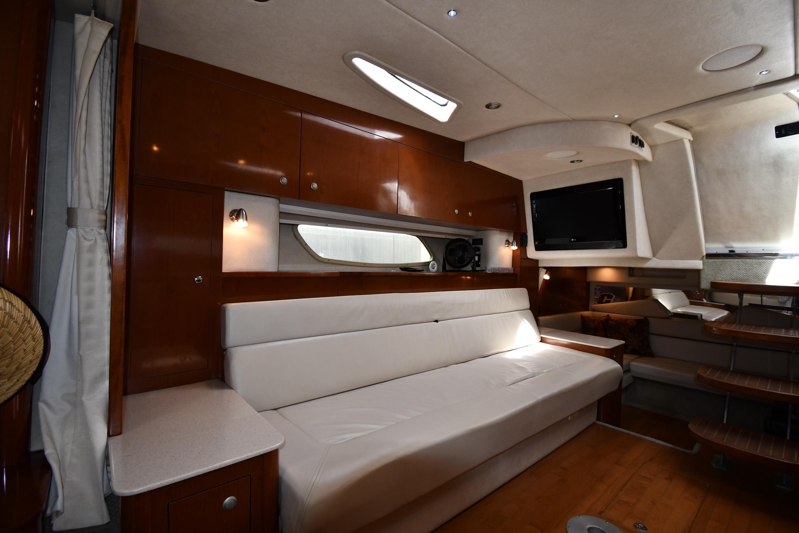 Luxurious interior of 2008 Sea Ray Sundancer 350 yacht with plush seating and modern amenities.