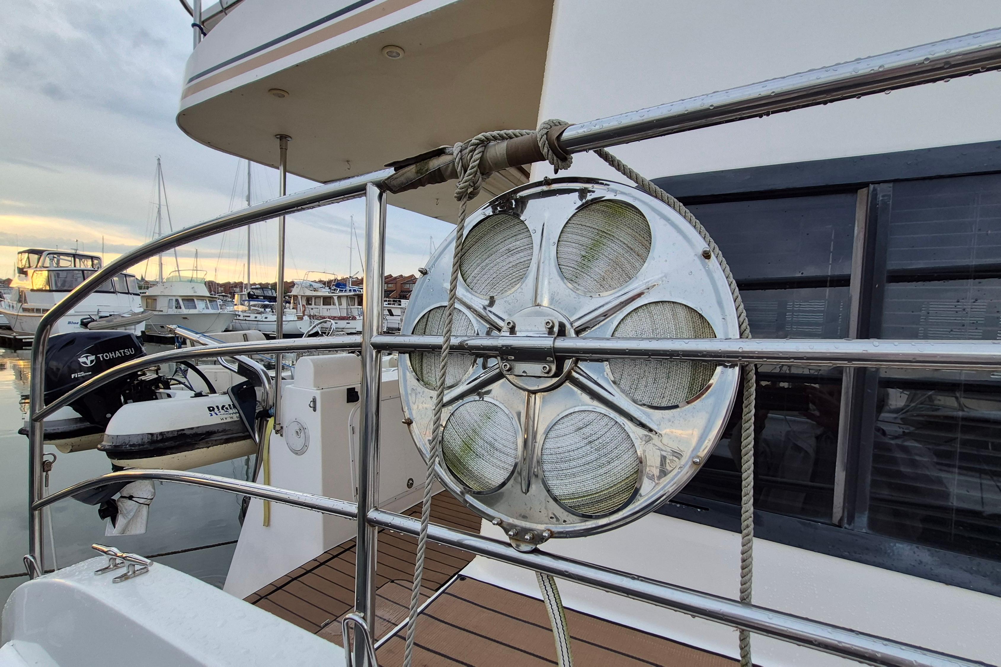 2009 Endeavour 40 Skylounge yacht with docked boats and marine equipment.