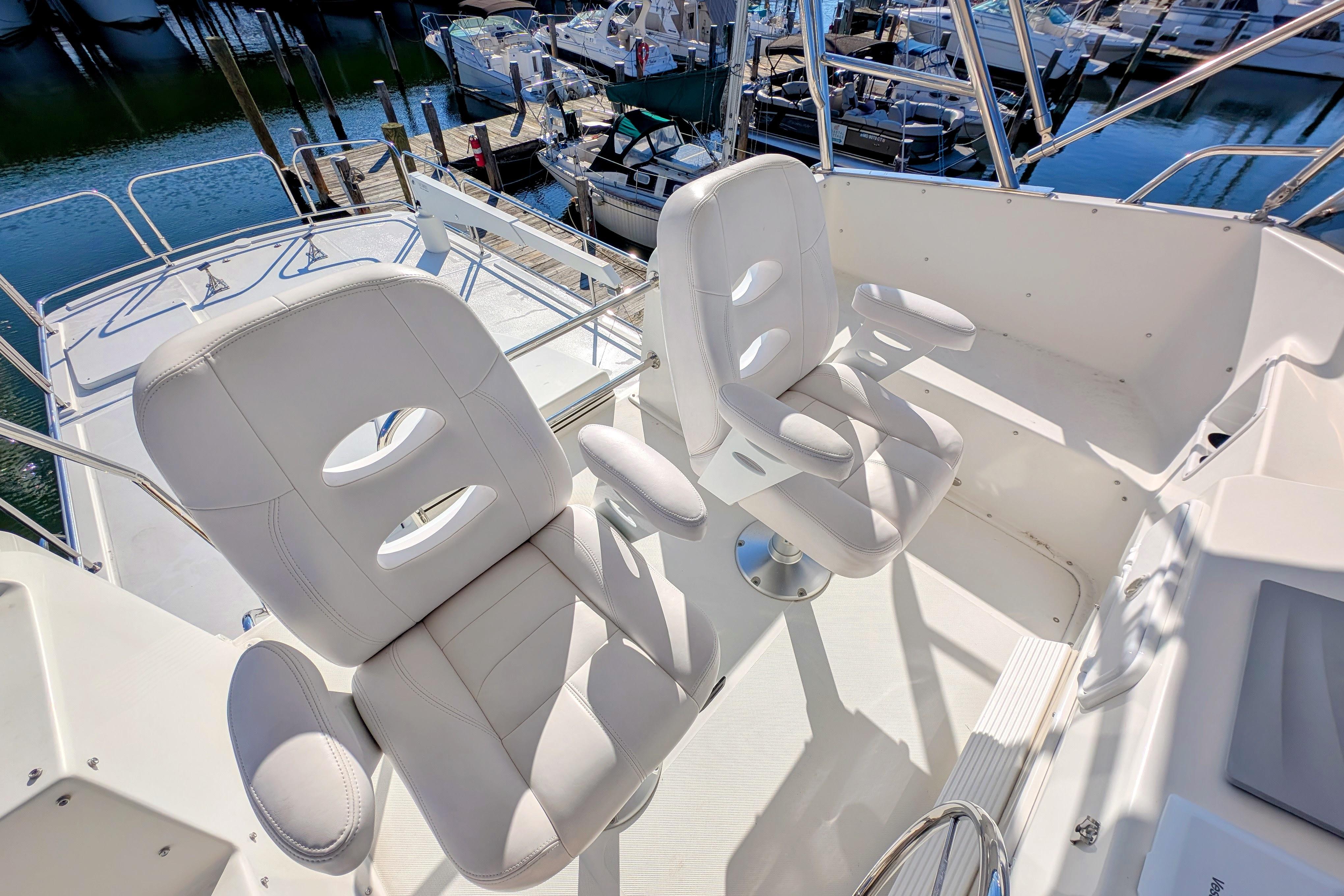 Luxury seating on 2015 American Tug 435 yacht, docked at marina.