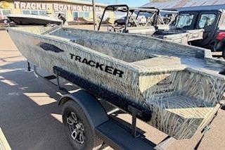 2026 Tracker Grizzly 1650 T Prairie Wings Edition boat on trailer at dealership.