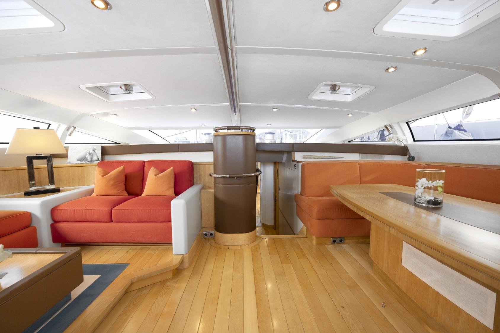 Luxurious 2005 CNB Sailing Yacht interior with modern seating and elegant wooden finishes.