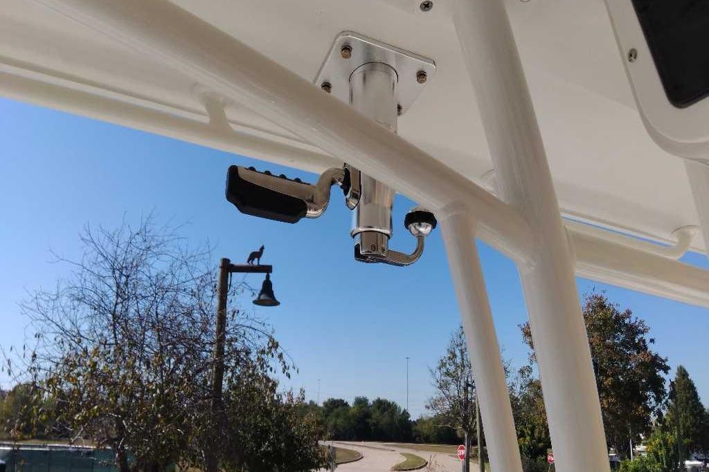 2026 Ranger 2600 Bay boat detail with rod holder, against a clear blue sky.