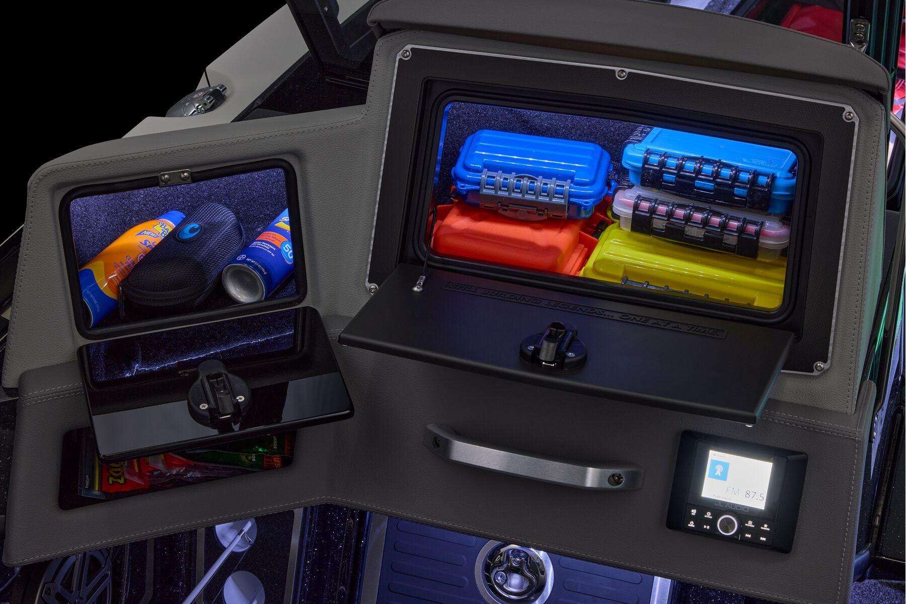 Manufacturer Provided Image: 2026 Ranger 620xFS Pro storage compartments with colorful gear boxes and sunscreen.