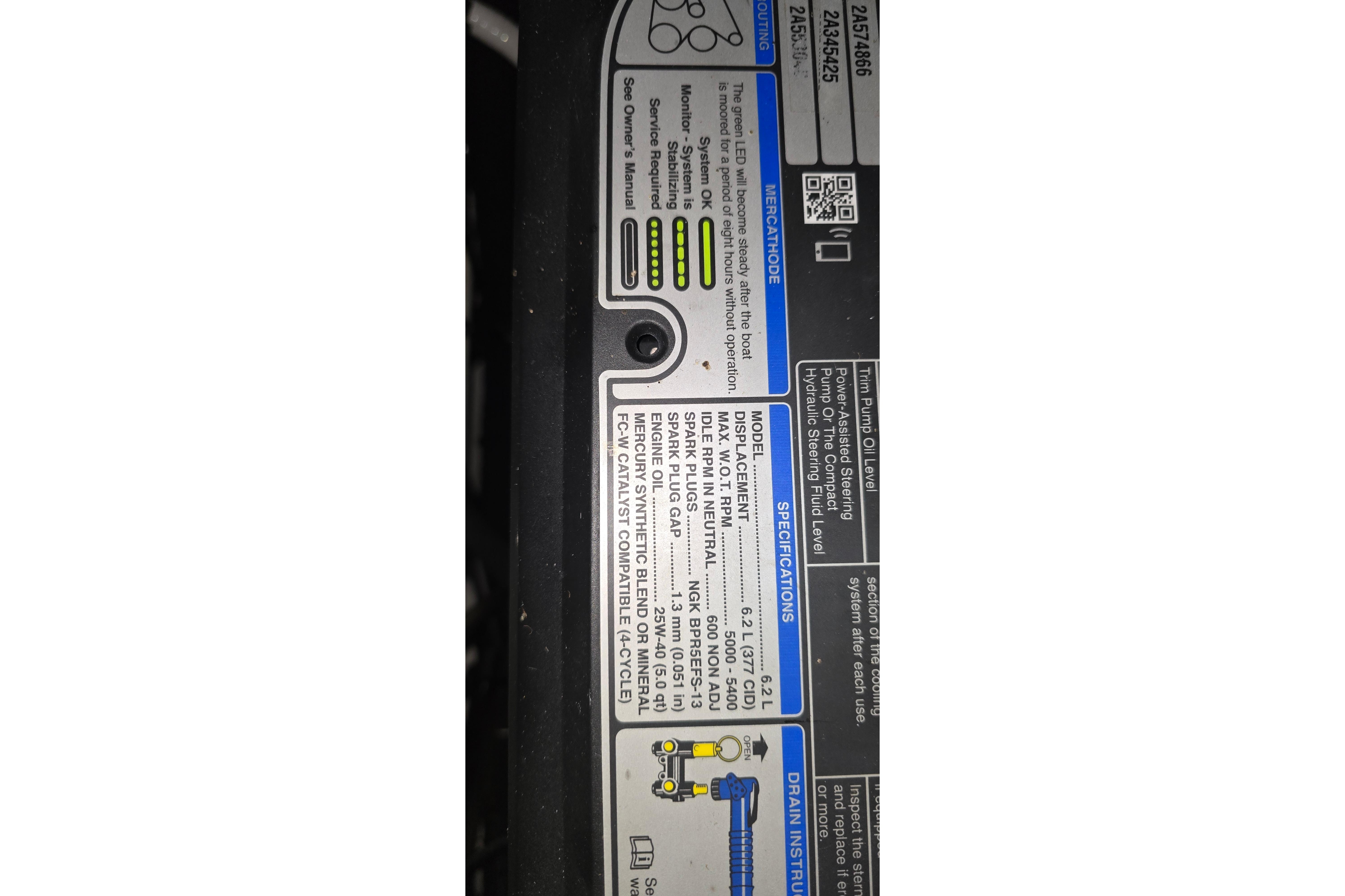 Label on 2018 Four Winns V355 boat engine, displaying specifications and maintenance instructions.
