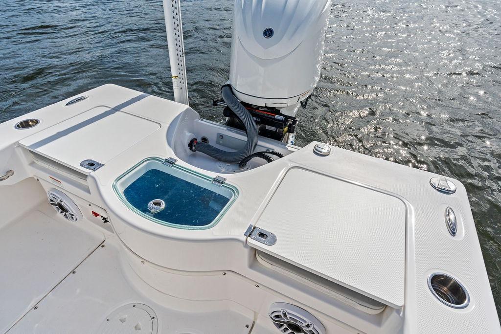 2023 Everglades 243 Center Console boat with motor and fishing amenities on water.