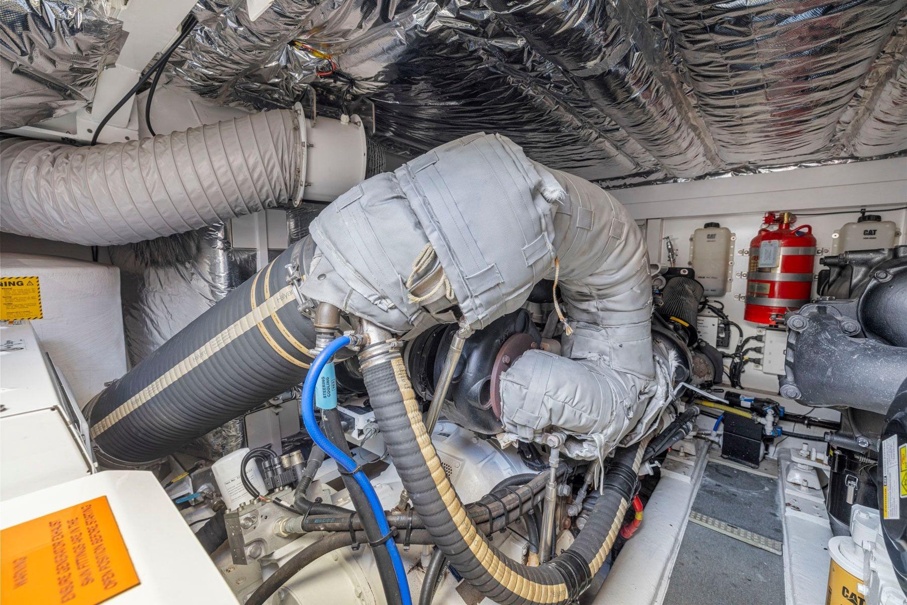 Engine room of a 2015 Princess 60 Flybridge Motor Yacht, showcasing insulated components and equipment.