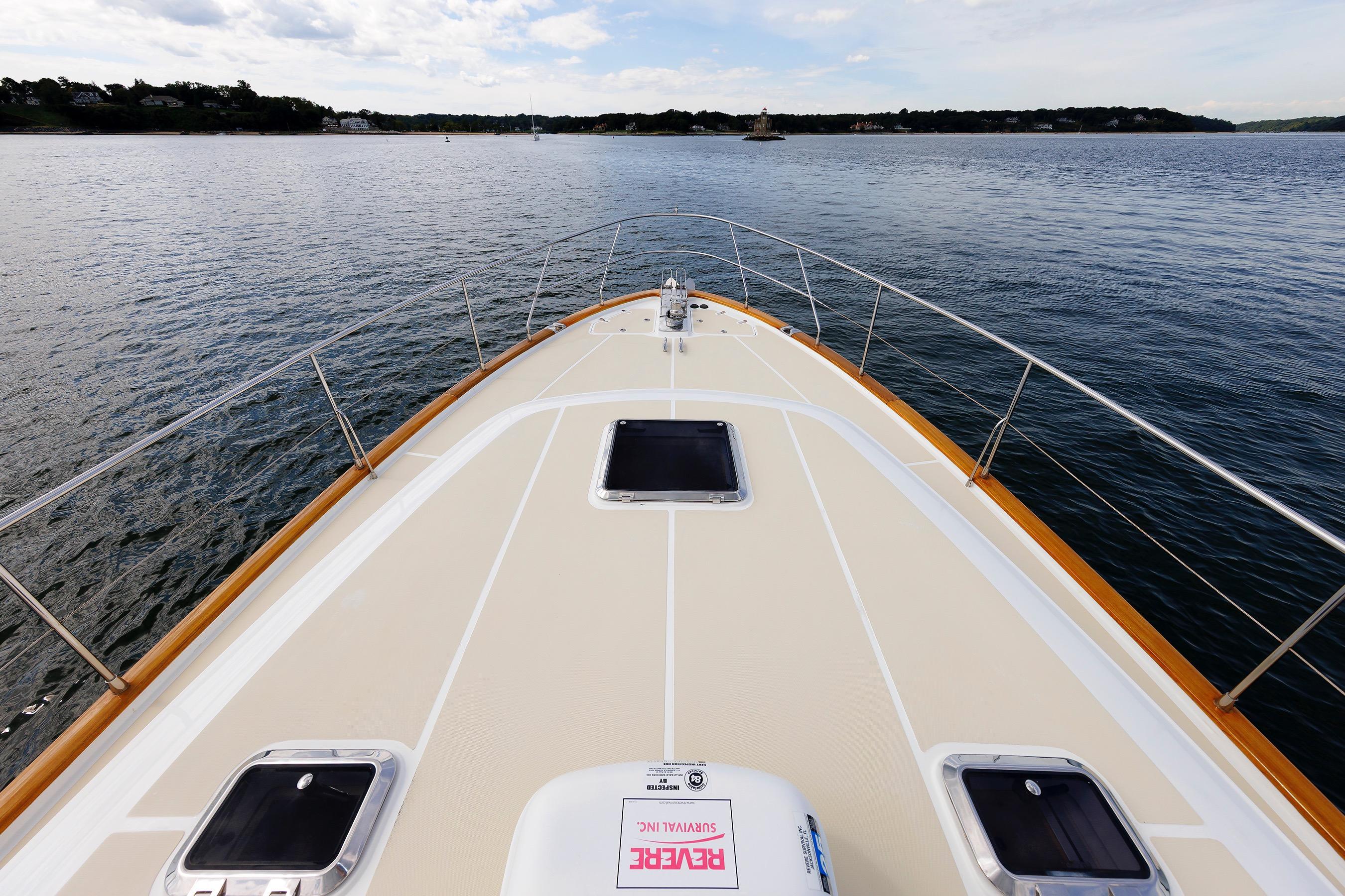Bow view of 2009 Hunt Yachts 52 Express on calm water.