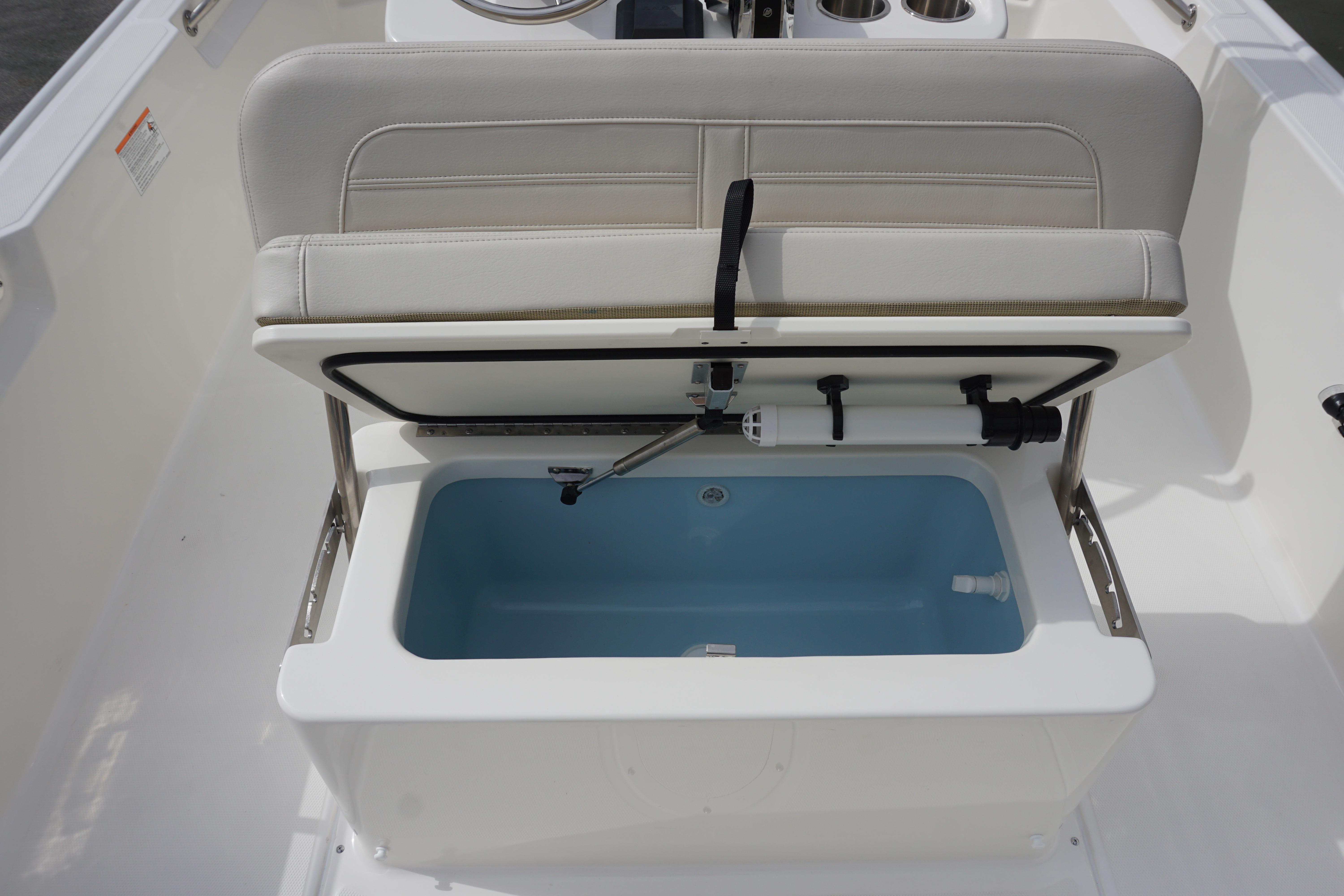 2026 Boston Whaler 190 Montauk boat seat with open storage compartment.