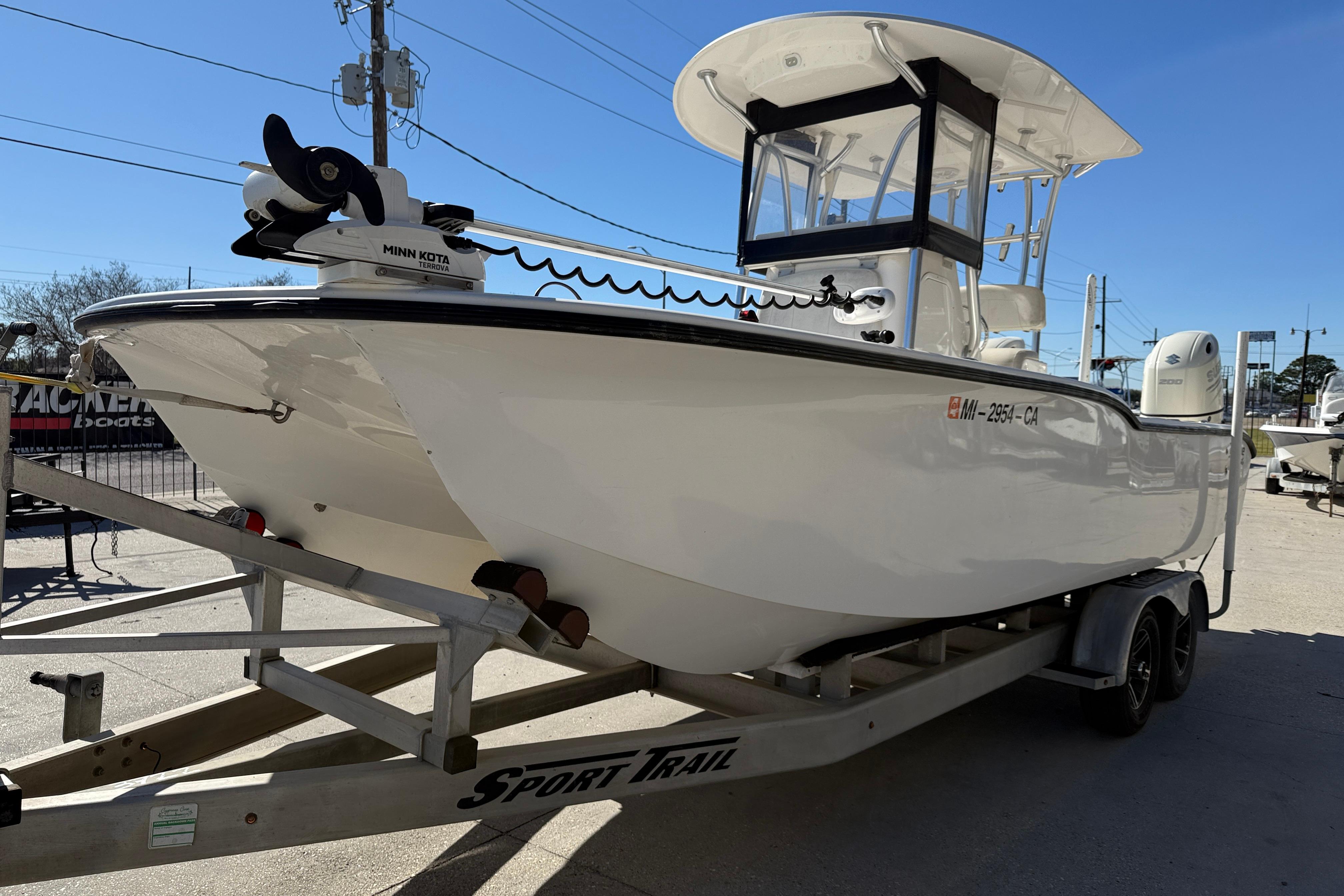 2020 Tideline 235 Hybrid boat on trailer, featuring Minn Kota trolling motor.
