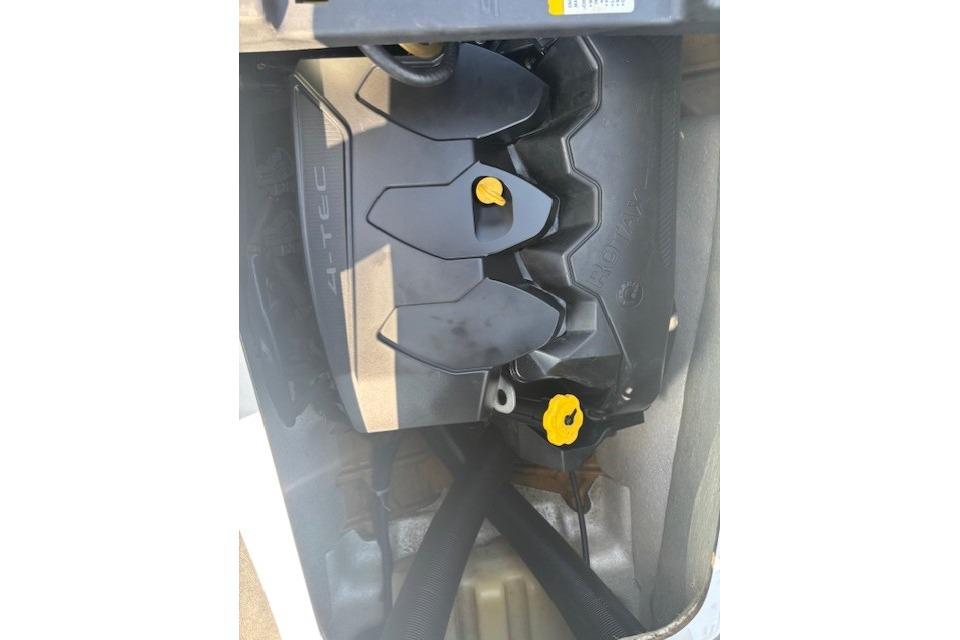 Engine compartment of a 2010 Sea-Doo GTX 155 watercraft, featuring 4-TEC engine components.