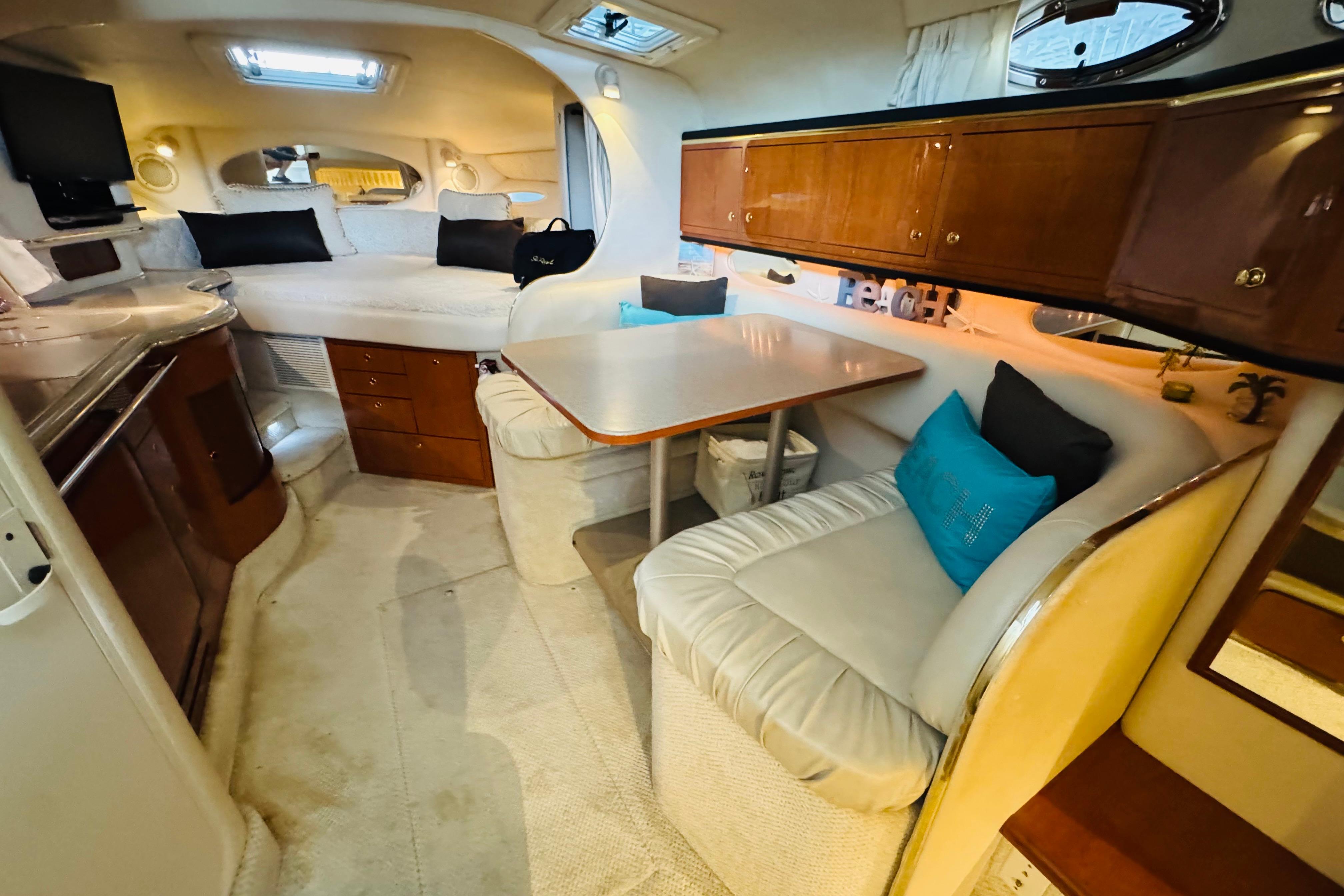 Interior of 2001 Sea Ray Sundancer 310 yacht with cozy seating and modern amenities.