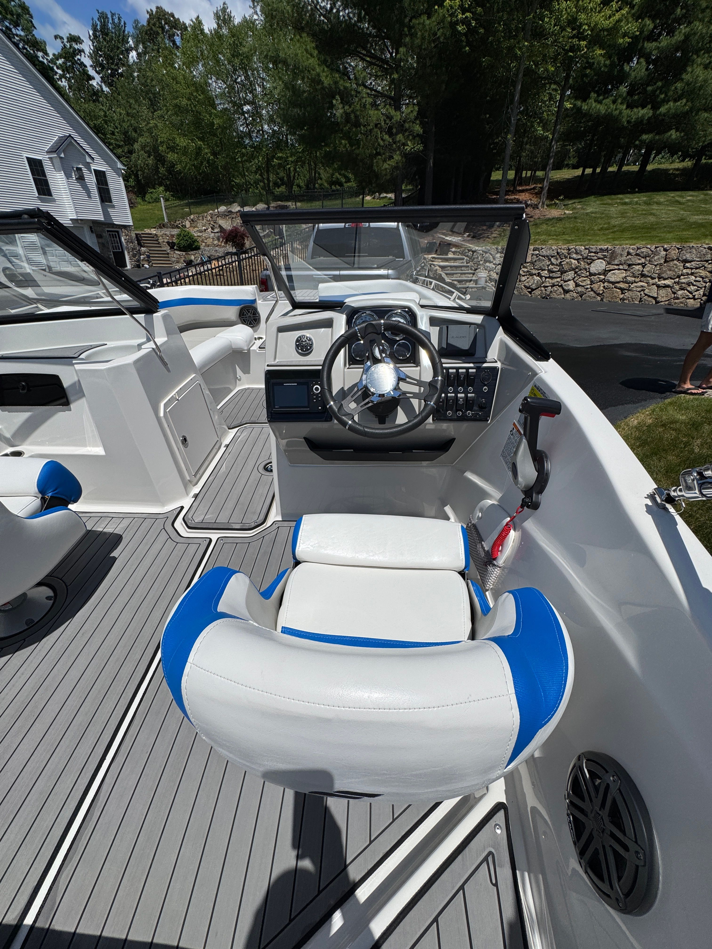 Interior of 2023 Starcraft SVX 190 OB boat with blue and white seating.