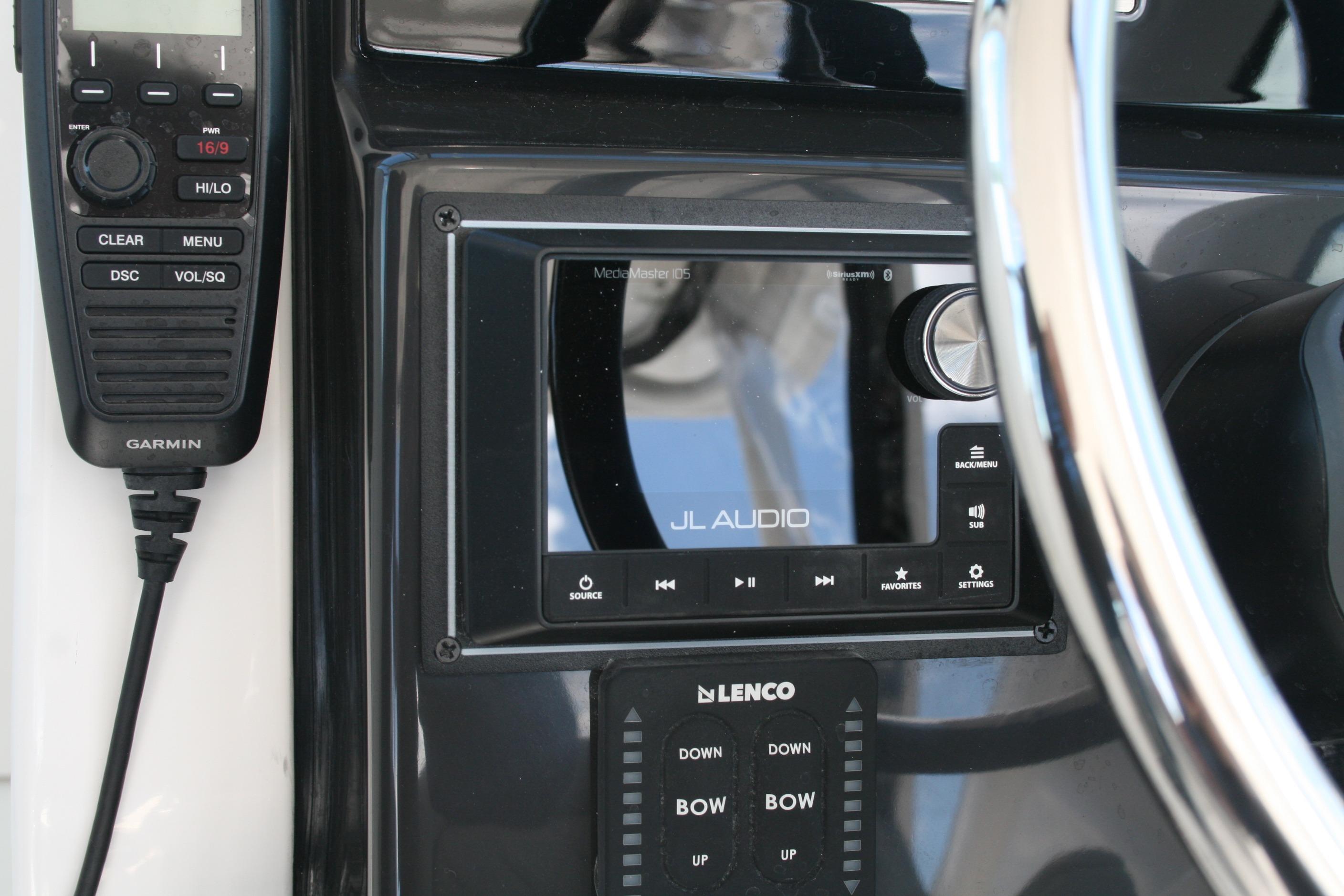 Control panel of 2026 Pursuit DC 266 Dual Console with JL Audio system and Garmin device.