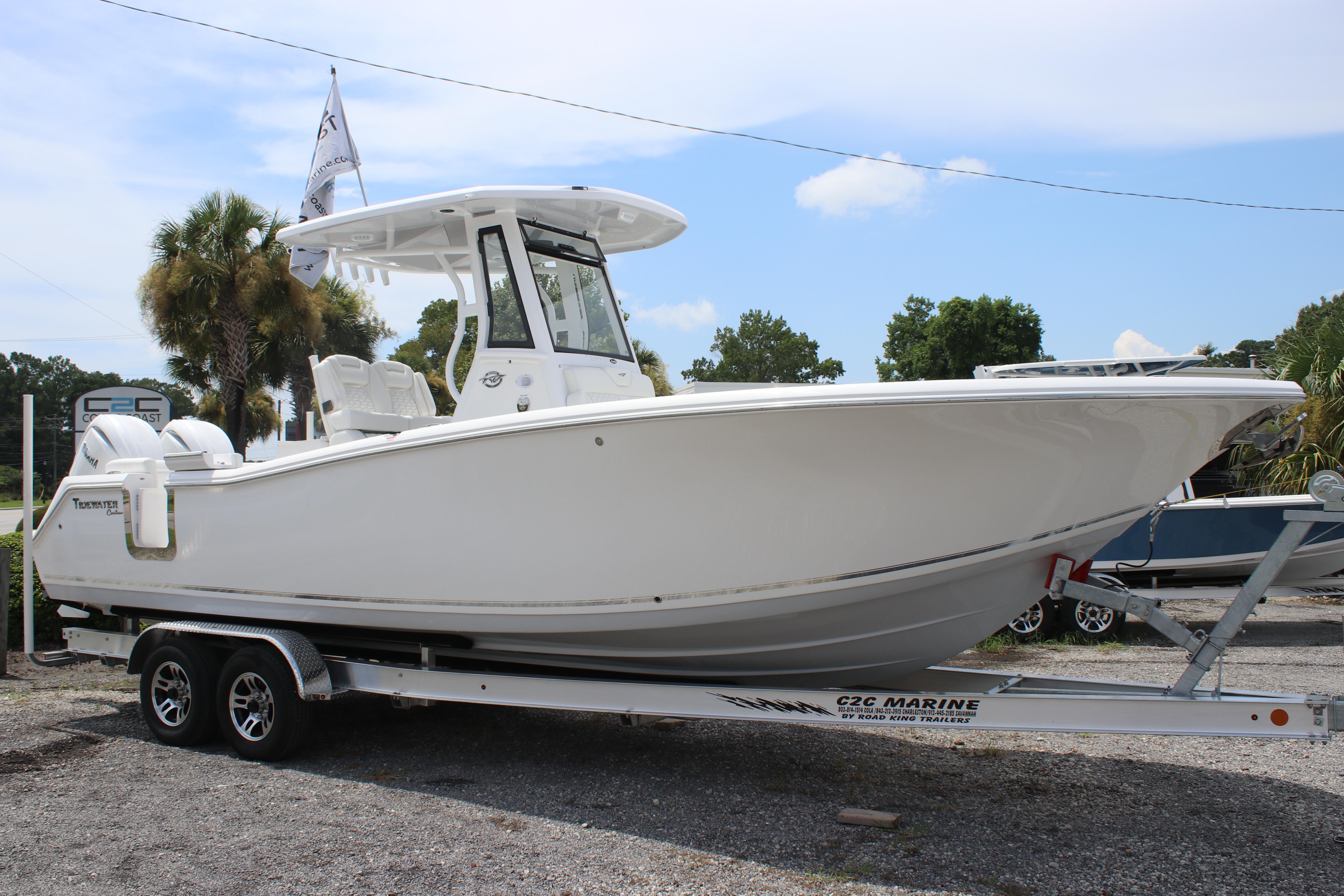 2026 Tidewater 272 LXF boat on trailer, parked outdoors under clear sky.