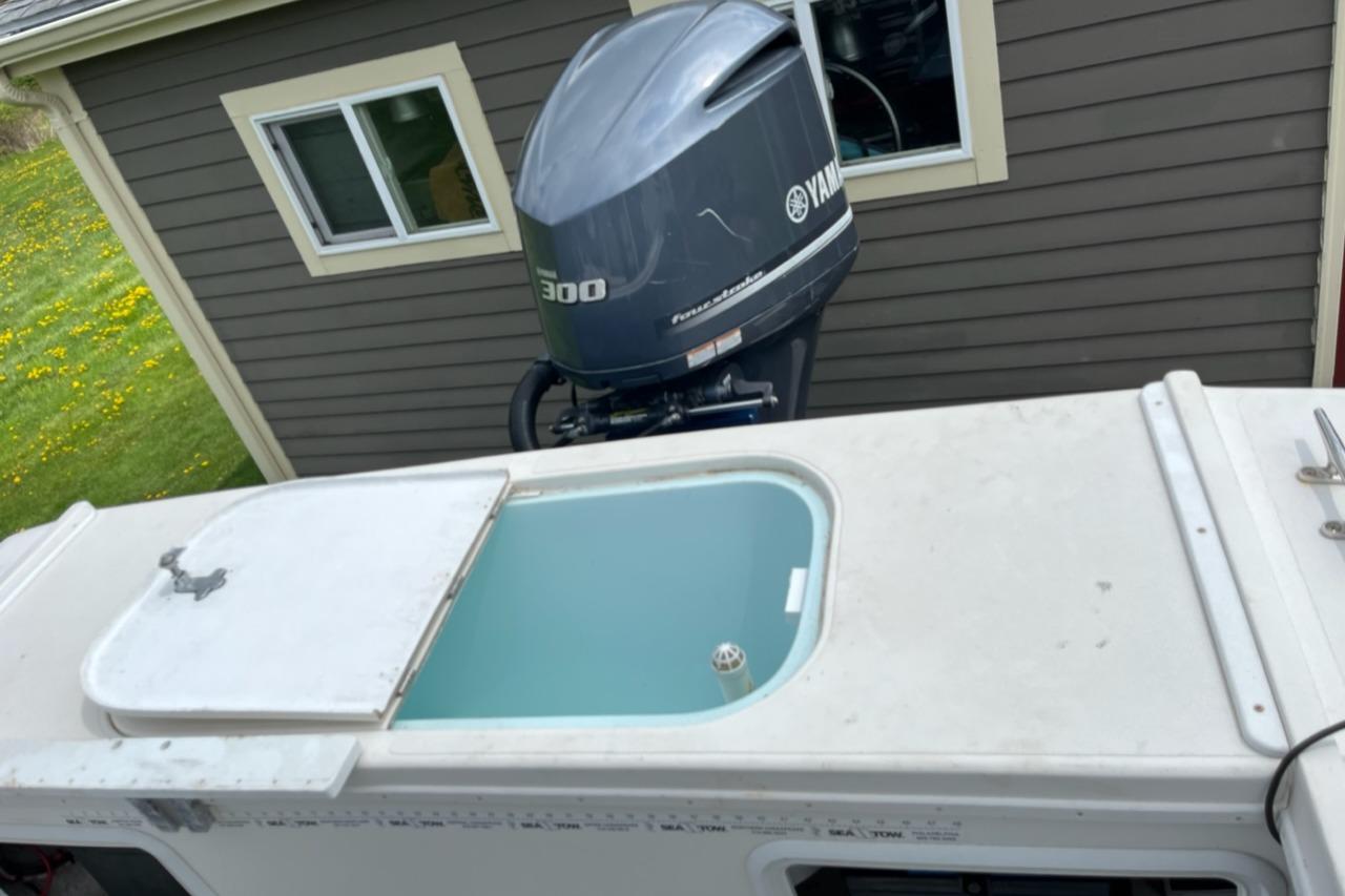 2012 Steiger Craft Miami boat with Yamaha 300 engine, docked near a house.
