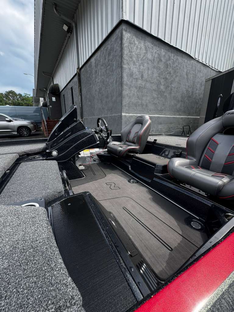 Interior of a 2022 Nitro Z21 XL Pro boat, gray and red seats.