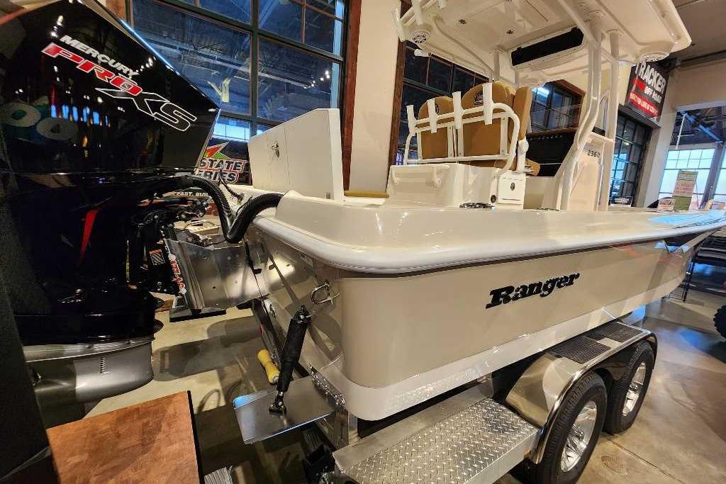 2025 Ranger 2360 Bay boat with Mercury Pro XS engine on display indoors.