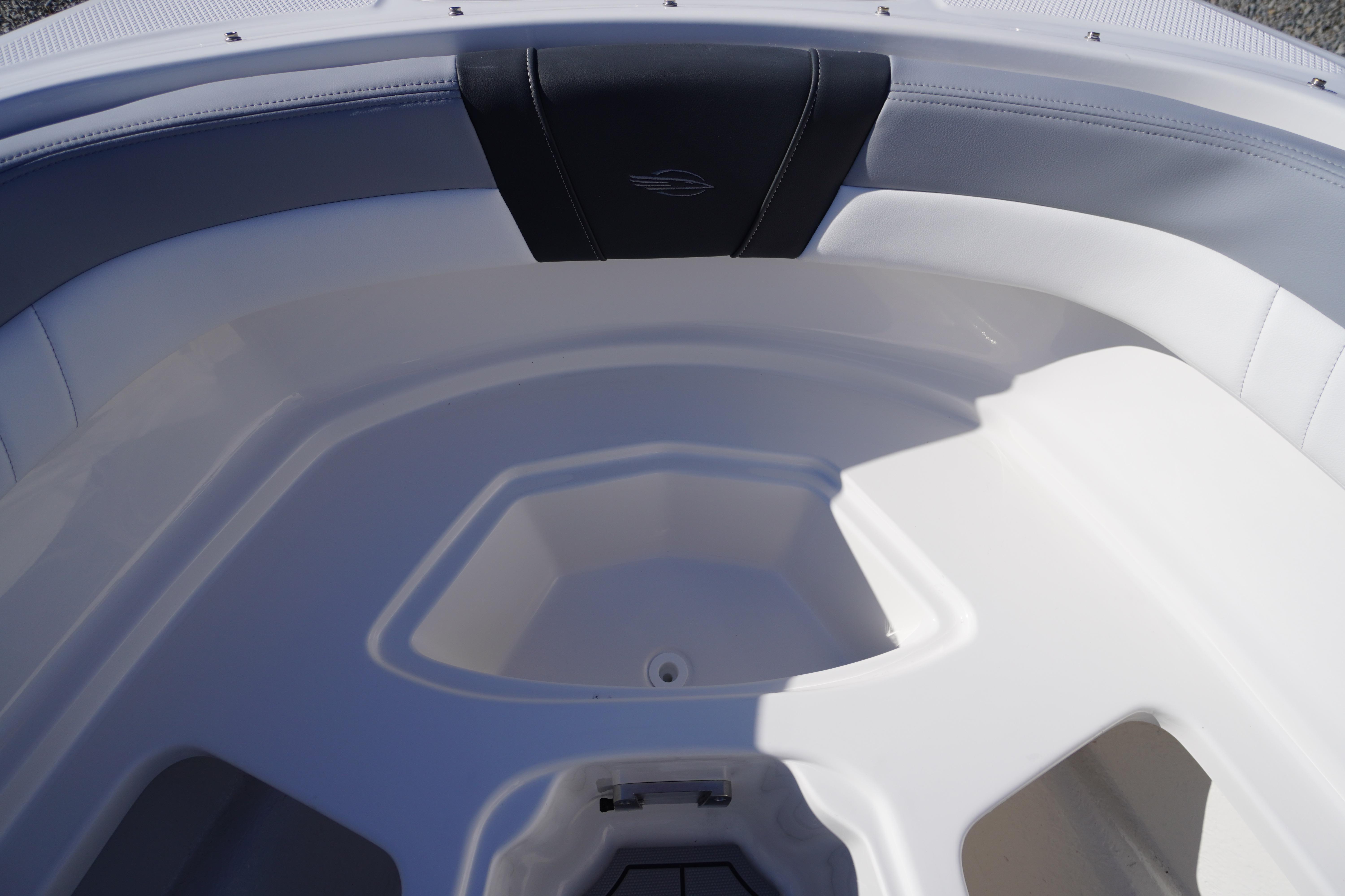 Interior view of 2026 Chaparral 23 SSi OB boat, featuring sleek white seating.