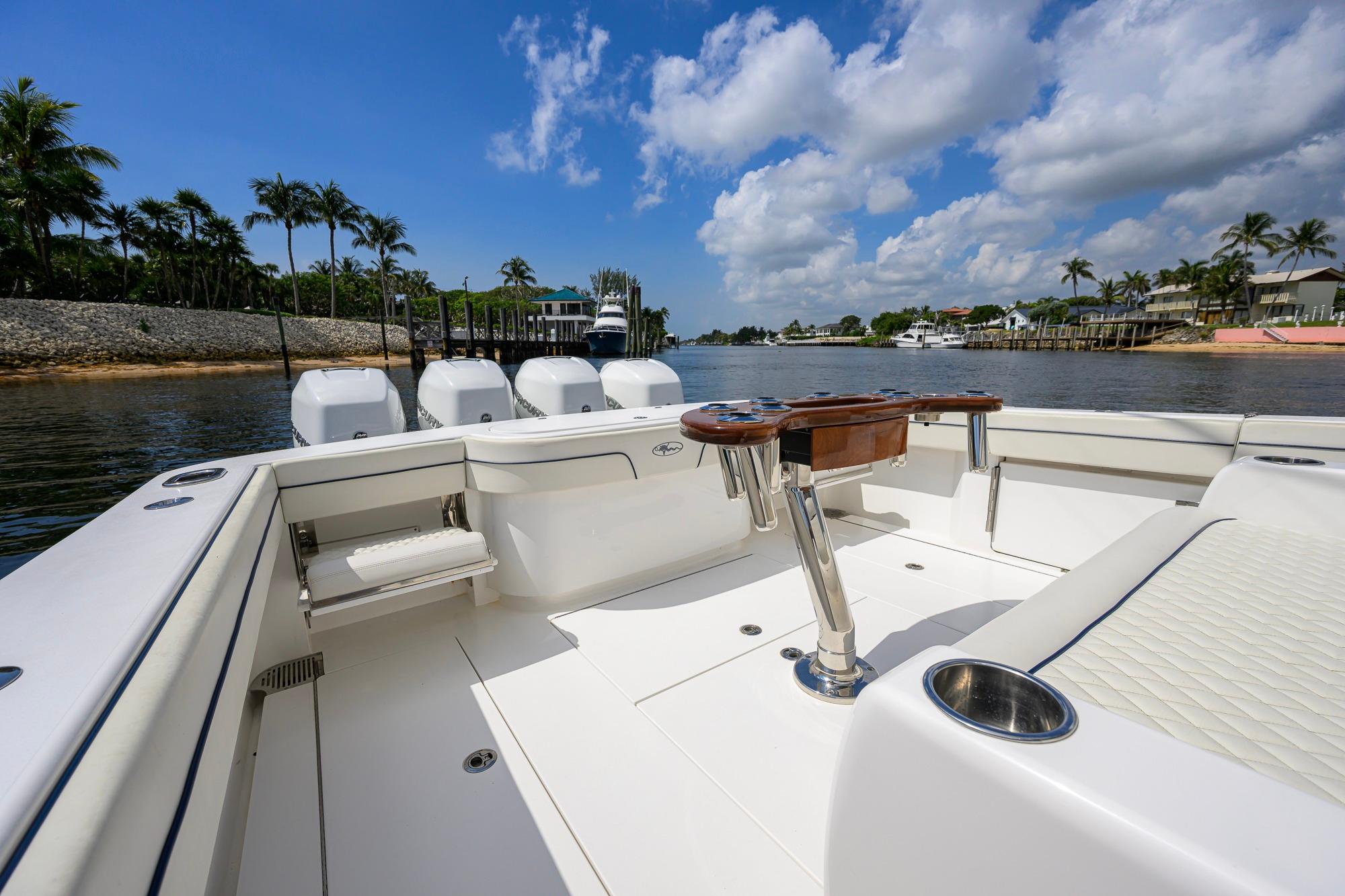 2020 Valhalla Boatworks V-41 on calm water, featuring spacious deck and luxurious seating.