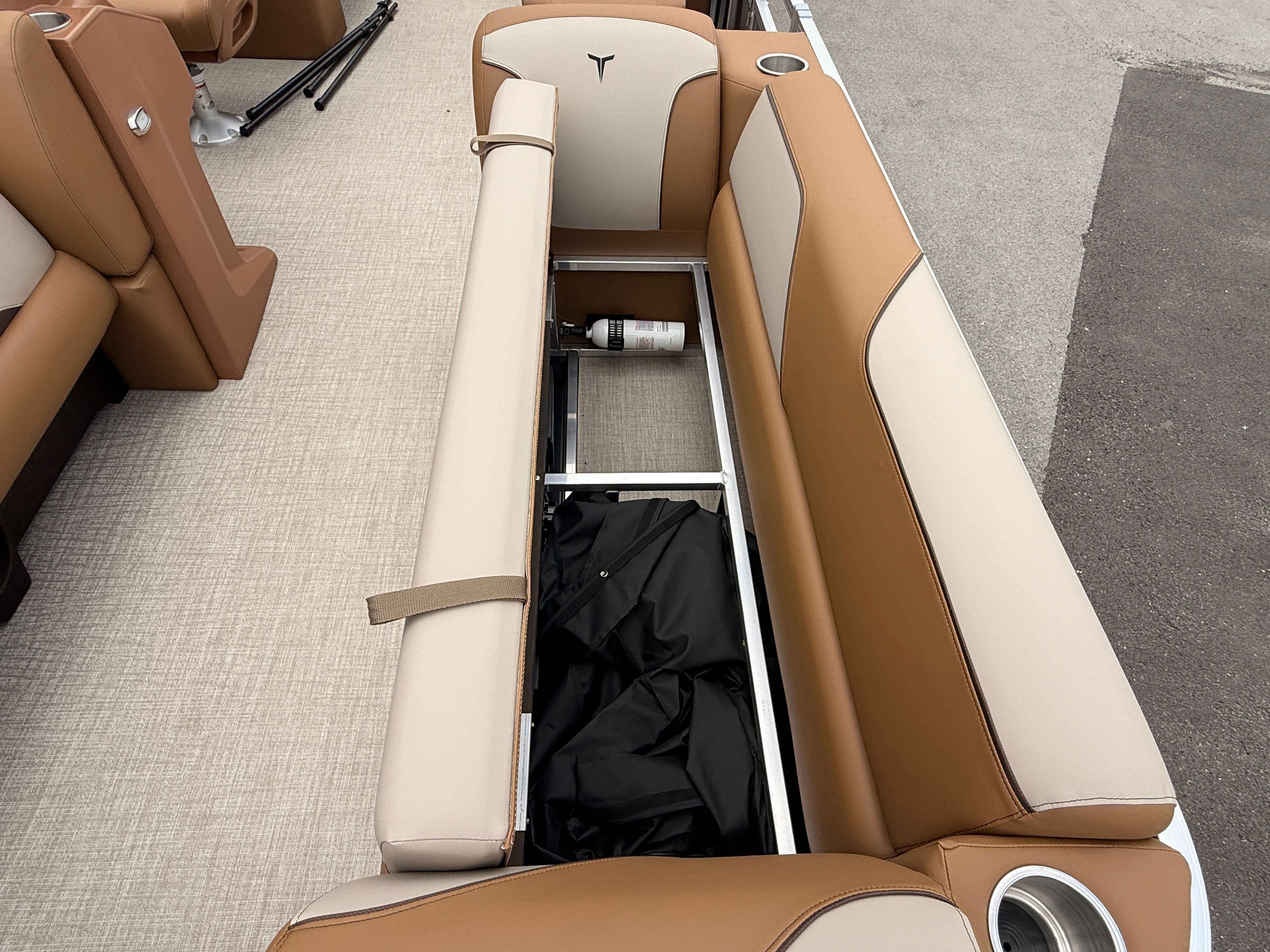 Interior of 2026 Tahoe 2380 Sport Quad Lounger with storage compartment.
