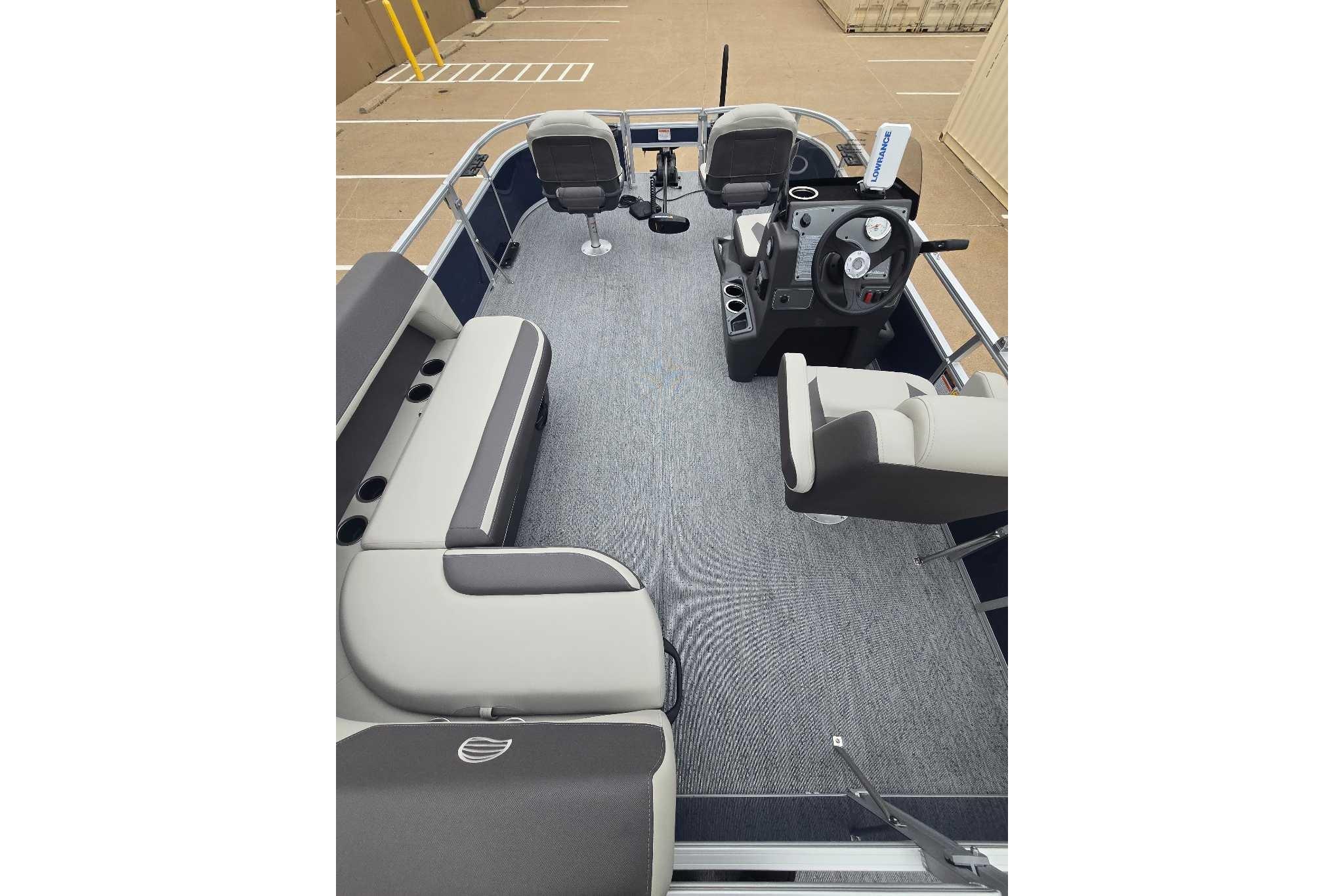 2026 Sun Tracker Bass Buggy 16 XL Select pontoon boat interior with seating and steering console.