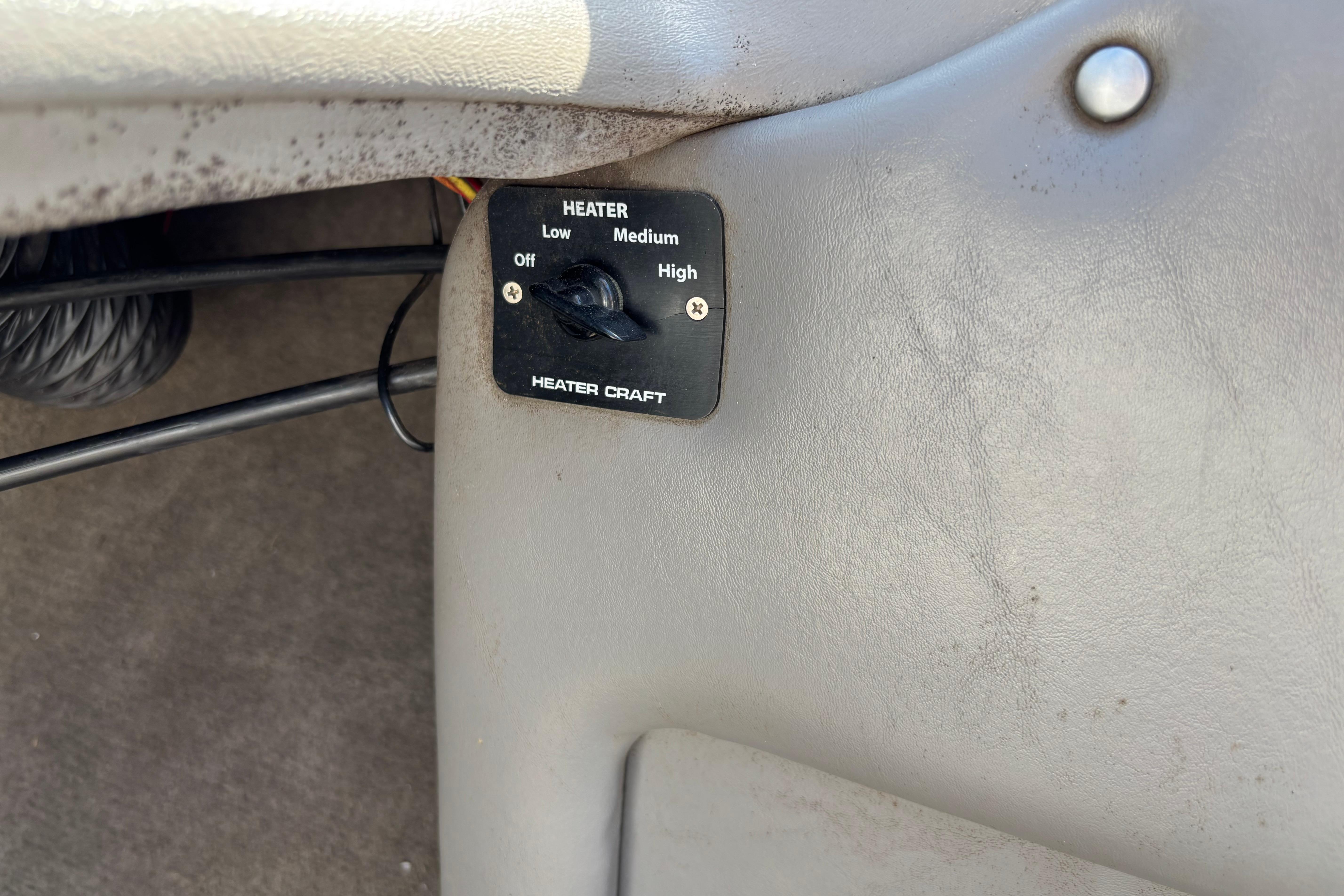 Heater control panel in 2004 Tigé 22V Limited Edition boat interior.