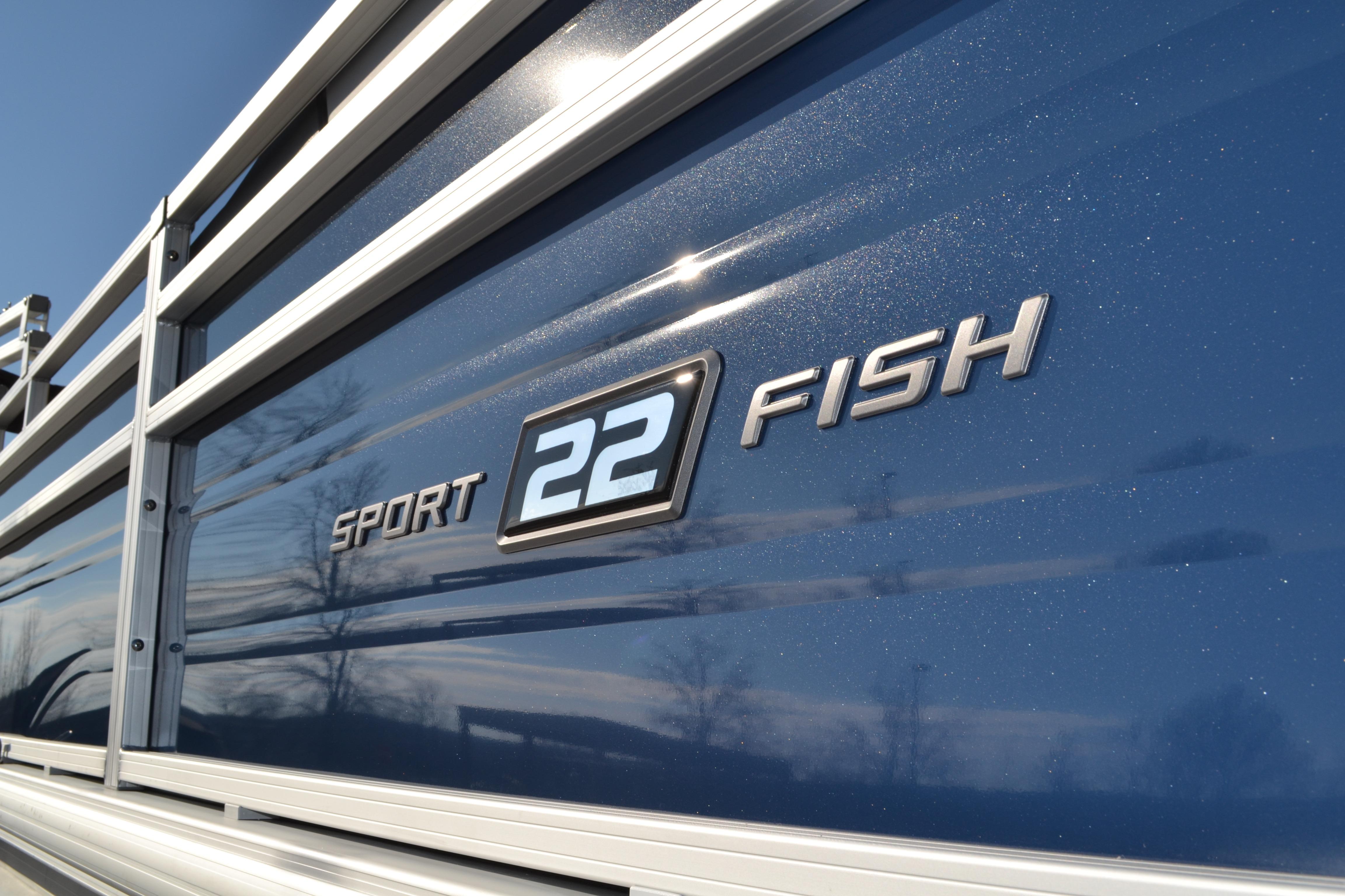 2026 Sun Tracker SportFish 22 XP3 boat side view with logo and metallic finish.