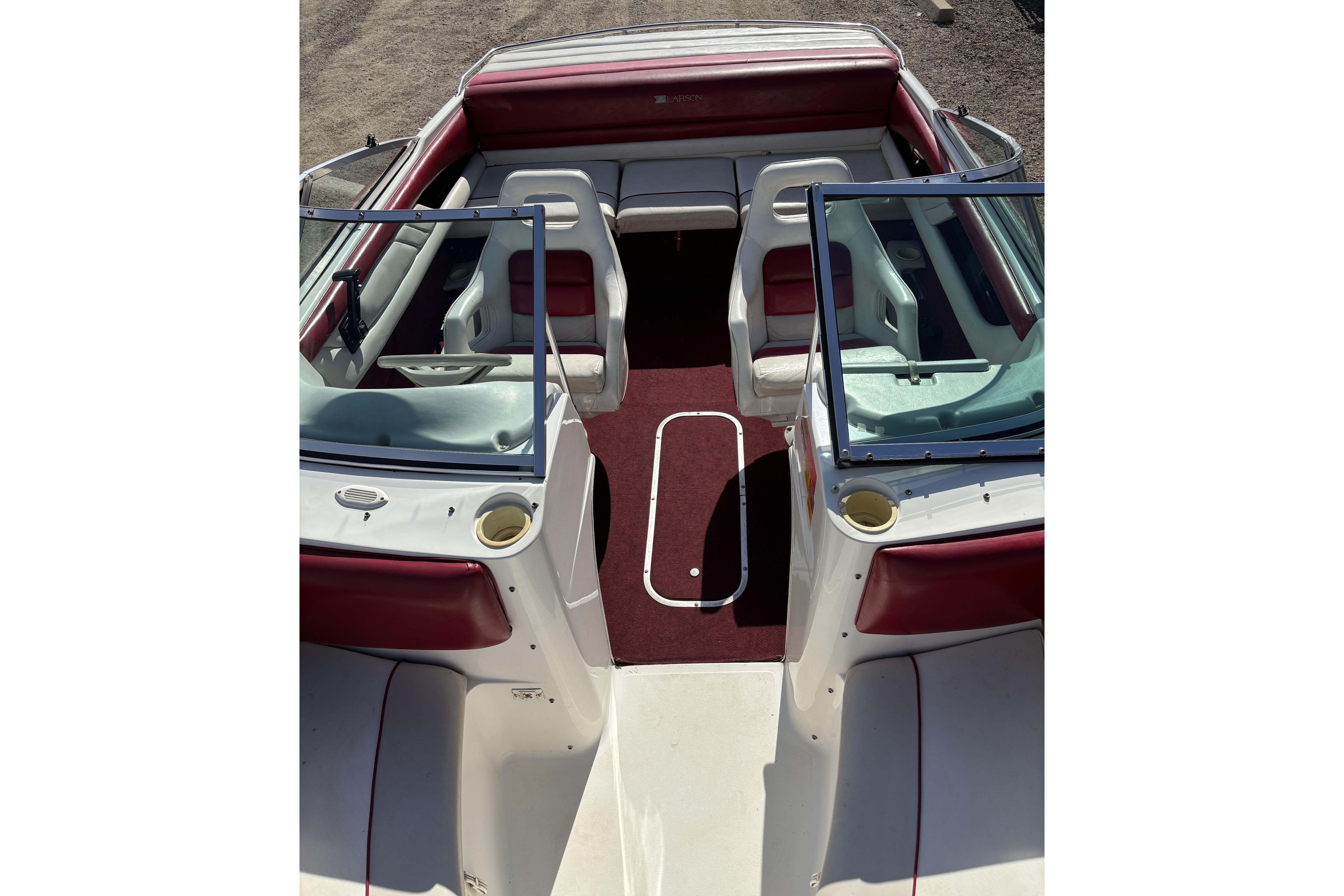 1993 Larson SEi 200 Cuddy I/O boat interior with red and white seating.