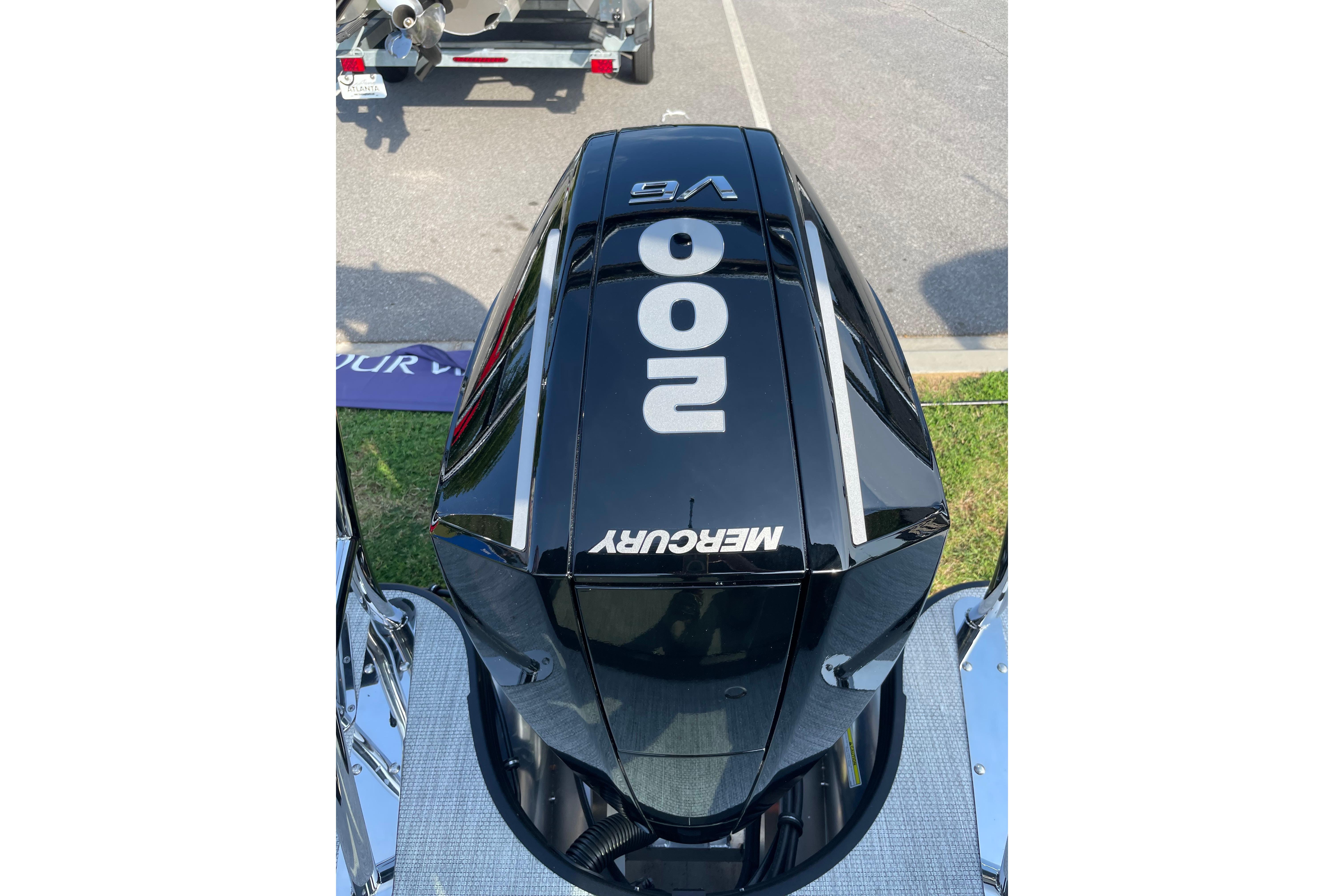 Outboard motor on Alera a24, 2027 model, featuring Mercury 200 V6 engine.