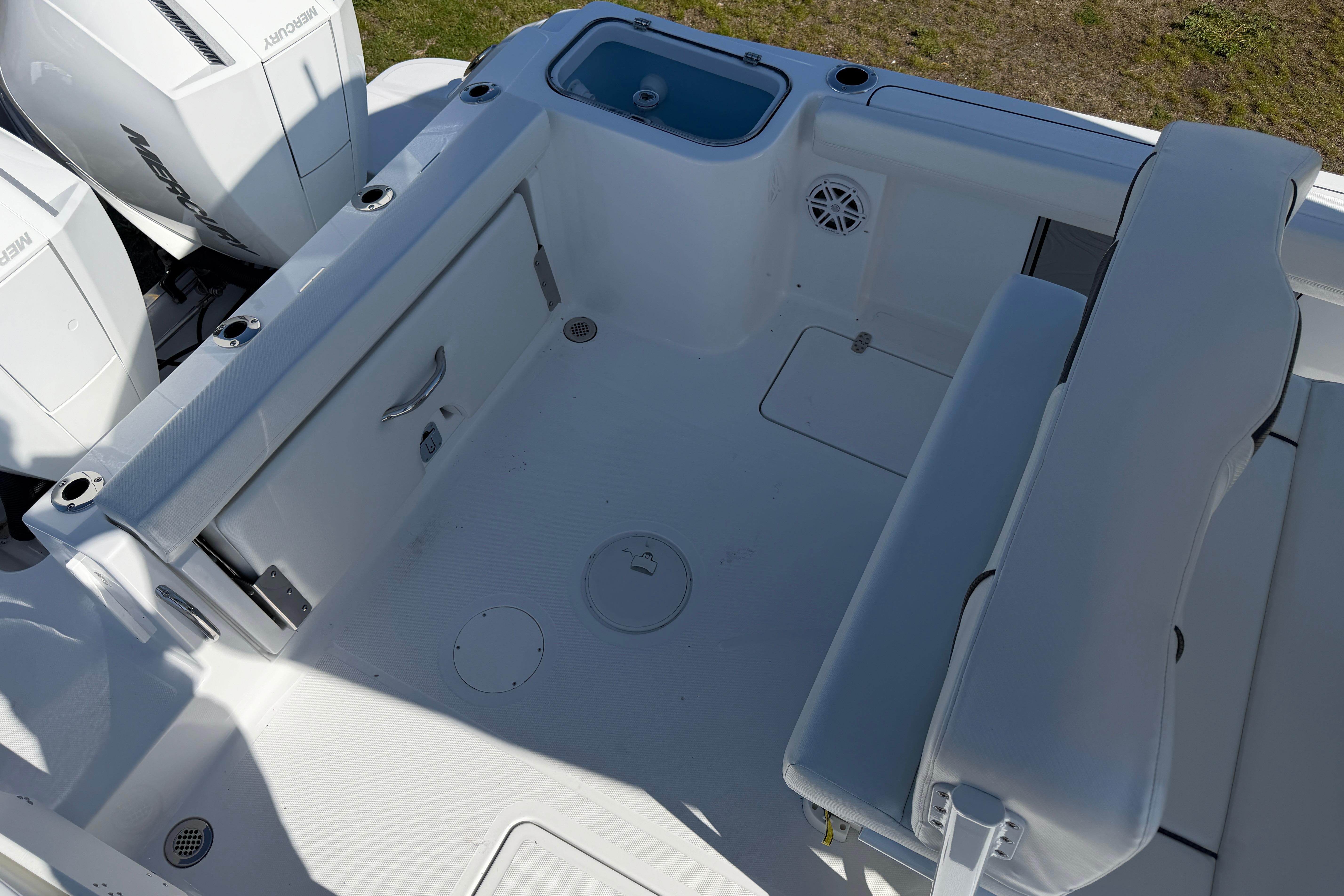 Interior of 2026 Wellcraft 243 Fisherman with seating and storage.
