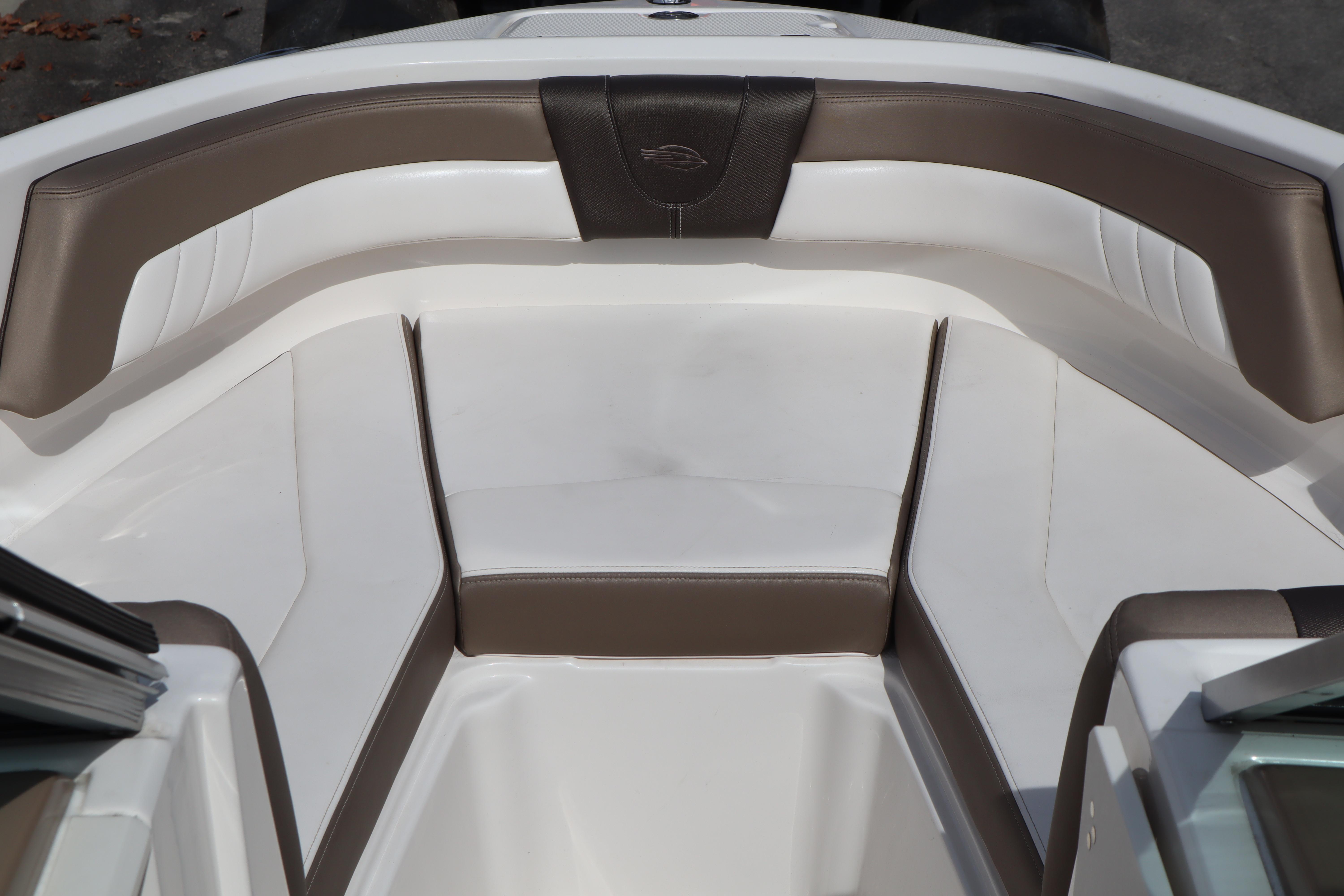 2021 Chaparral 21 SSi boat interior with brown and white seating.
