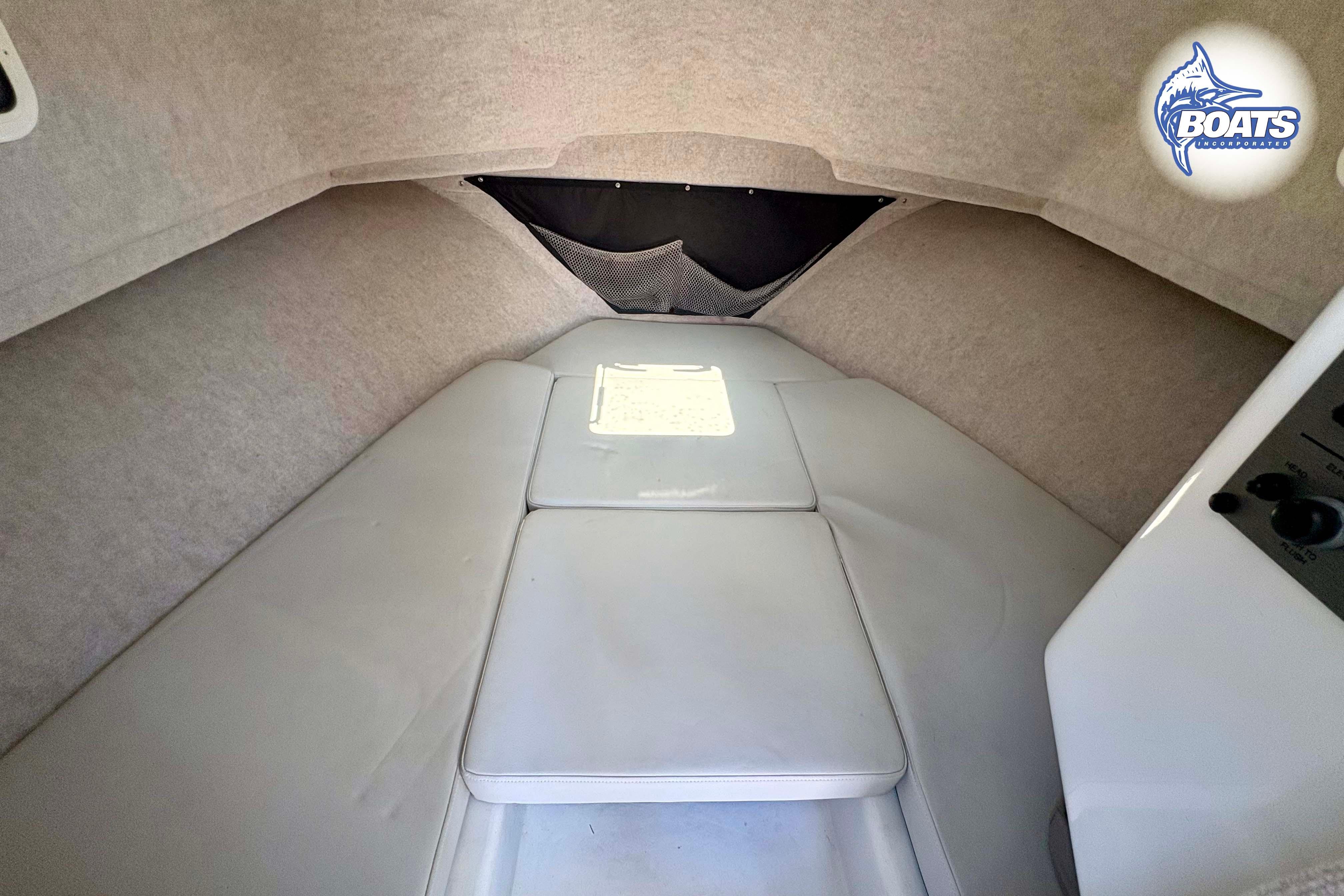 2021 Parker 2520 XLD Sport Cabin interior with cushioned seating and storage.