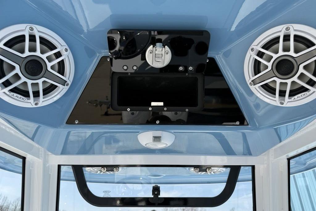 2026 Sportsman Open 252 Center Console with JL Audio speakers and blue interior.