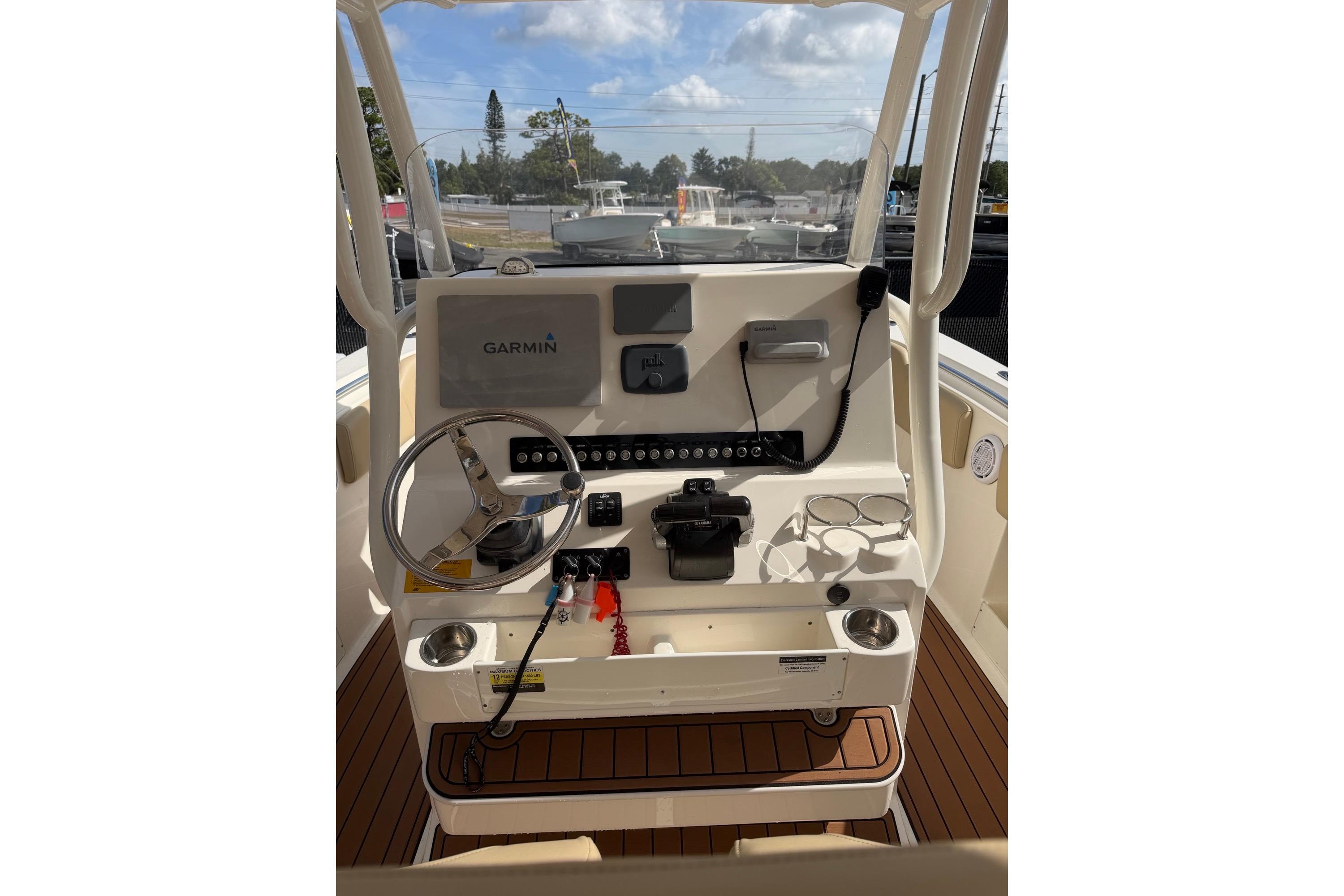2019 Key West 263 FS boat dashboard with Garmin navigation system and steering wheel.