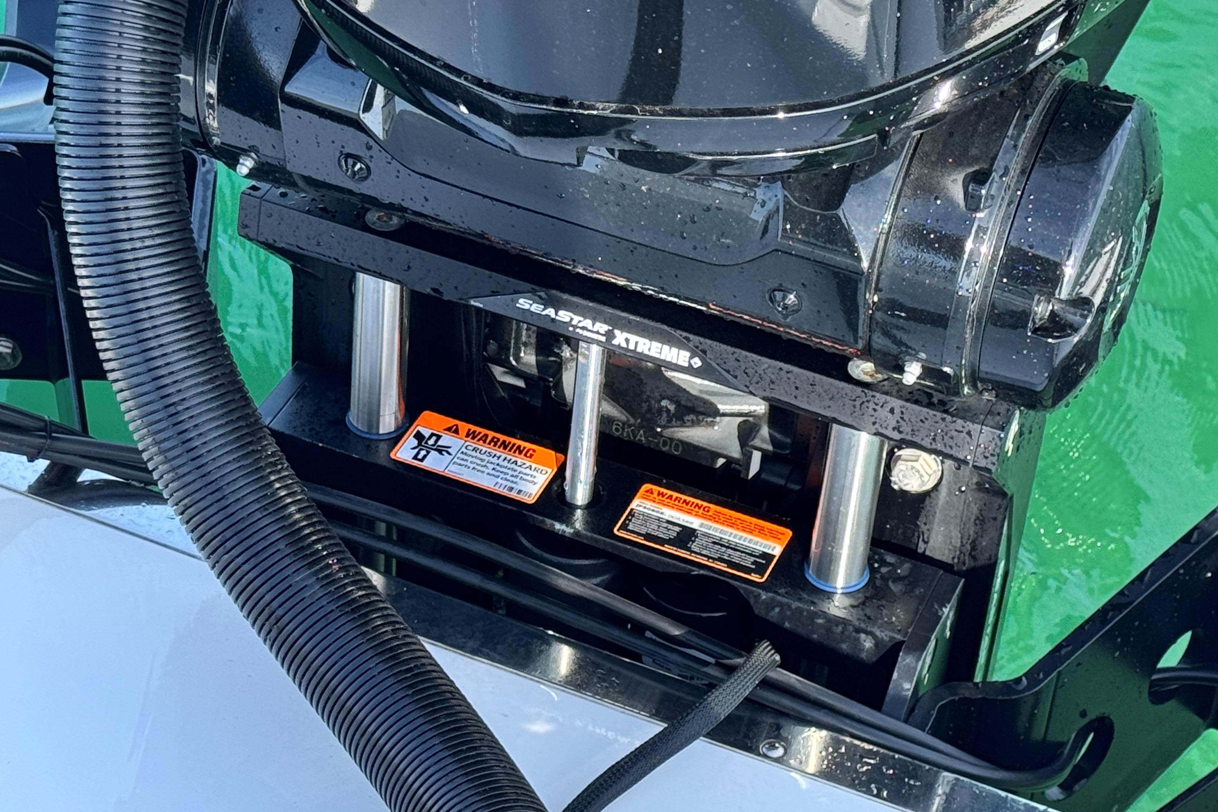 Close-up of 2025 Crevalle 24 HCO boat engine with SeaStar Xtreme components.