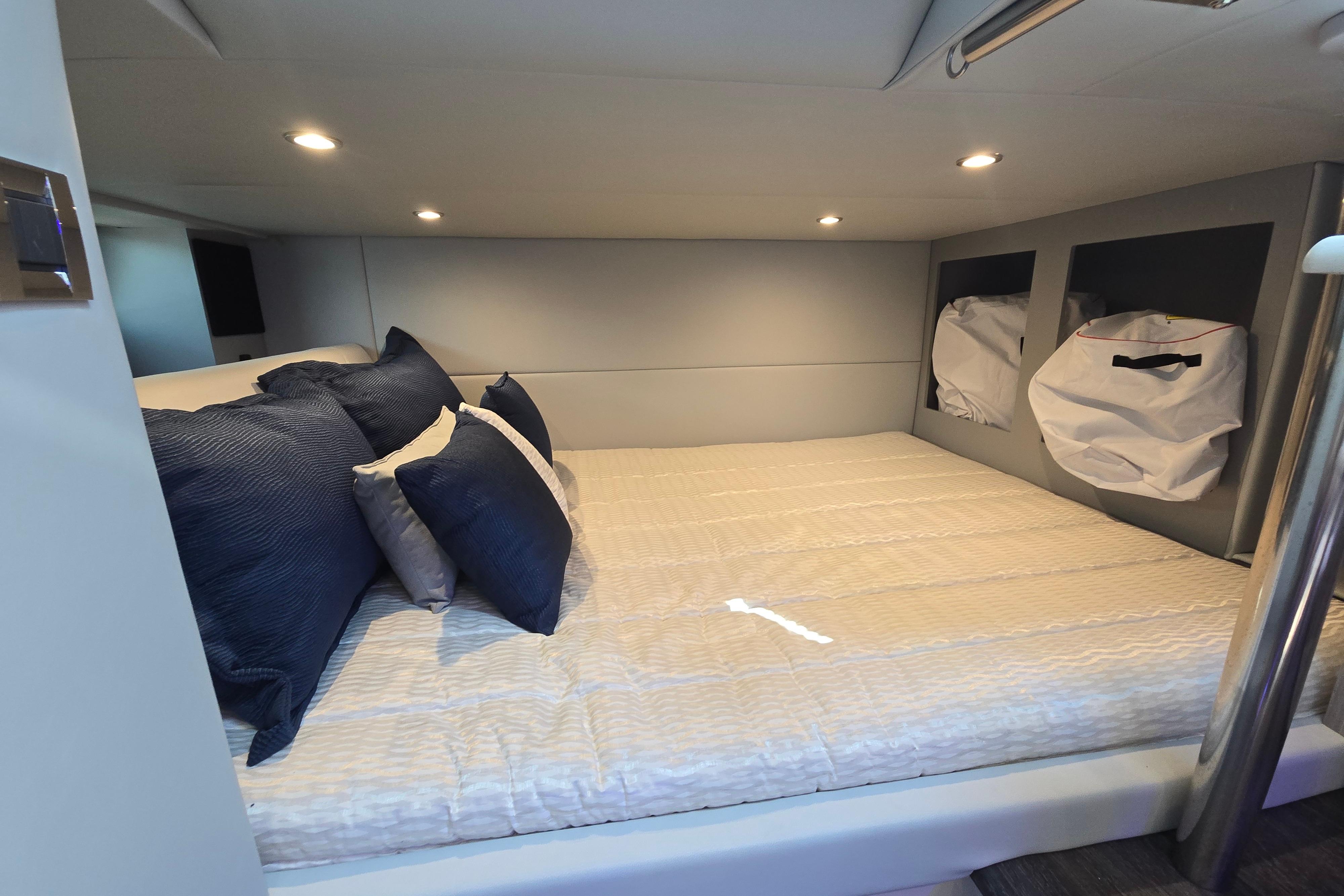 Luxurious cabin interior of 2025 Formula 380 Super Sport Crossover OB with cozy bedding.