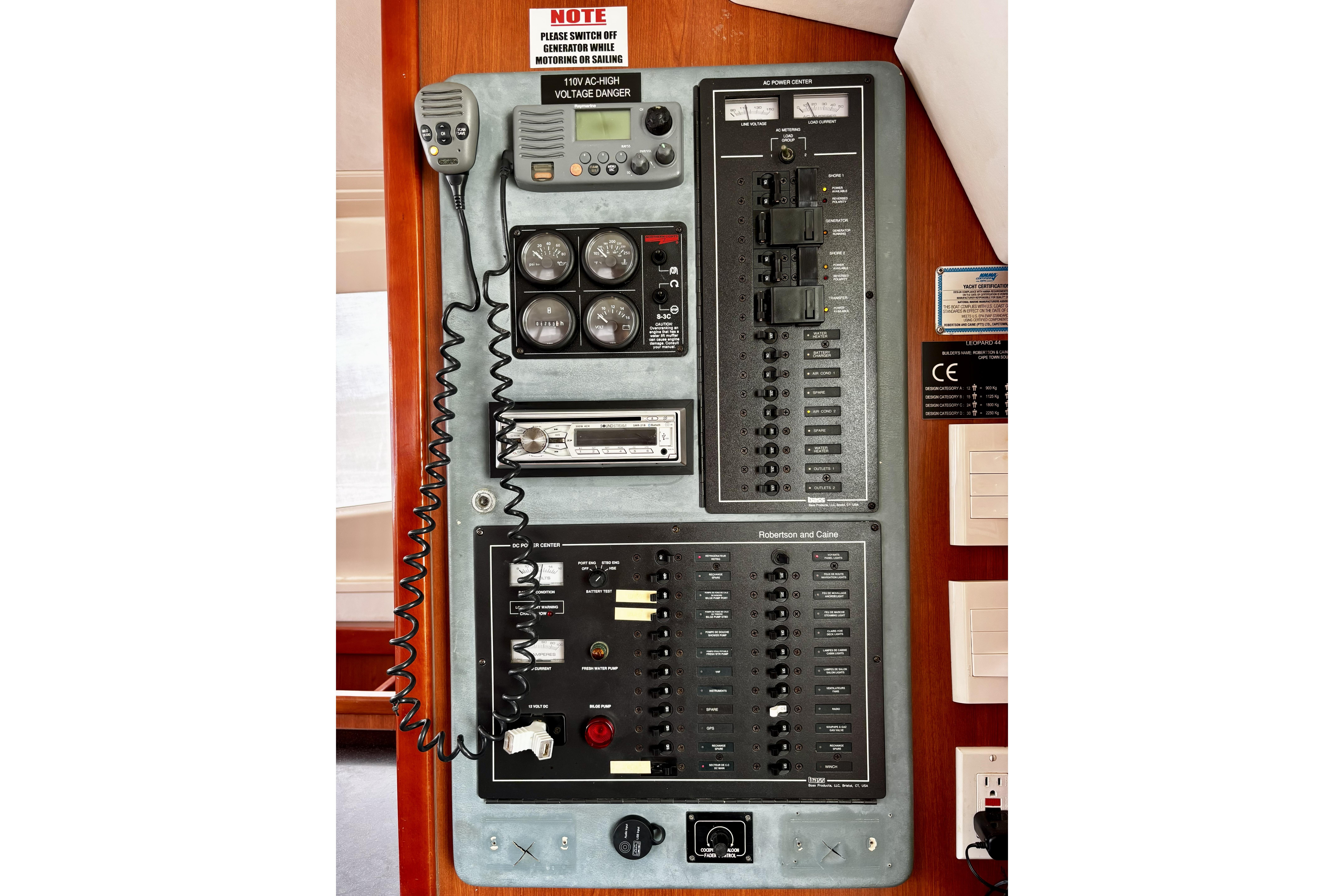 Electrical control panel on a 2012 Leopard 44 yacht, featuring gauges and switches.