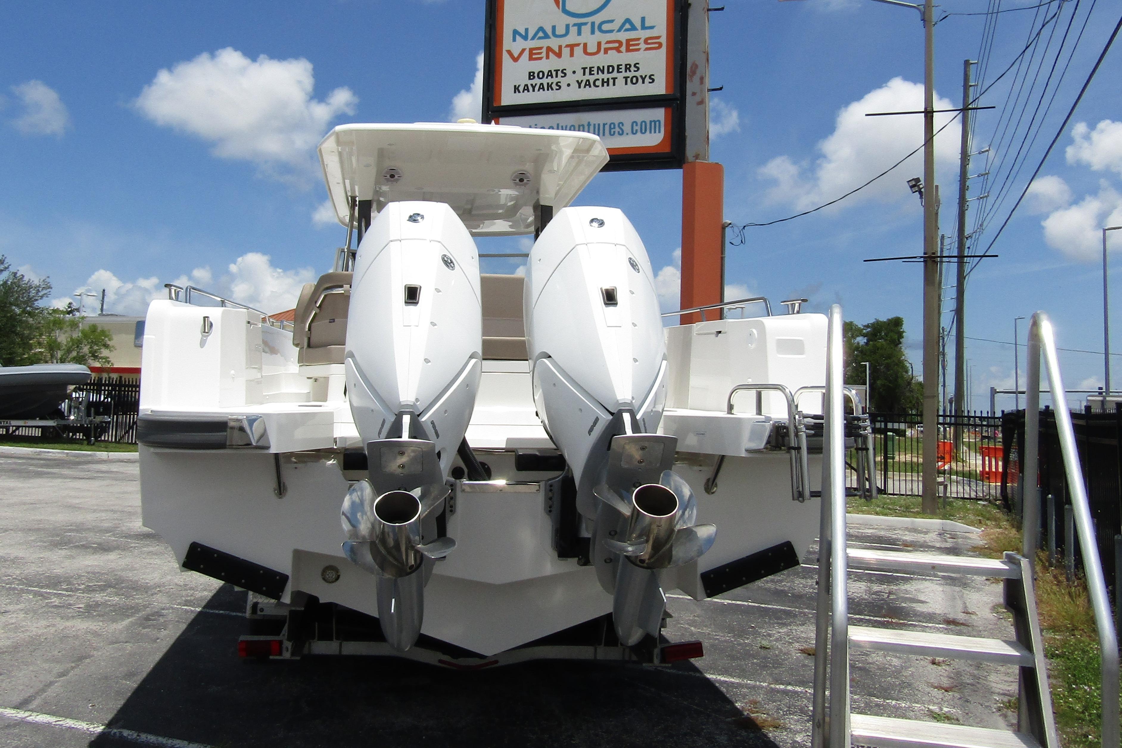 2025 Nimbus Tender 11 with dual outboard motors at Nautical Ventures dealership.