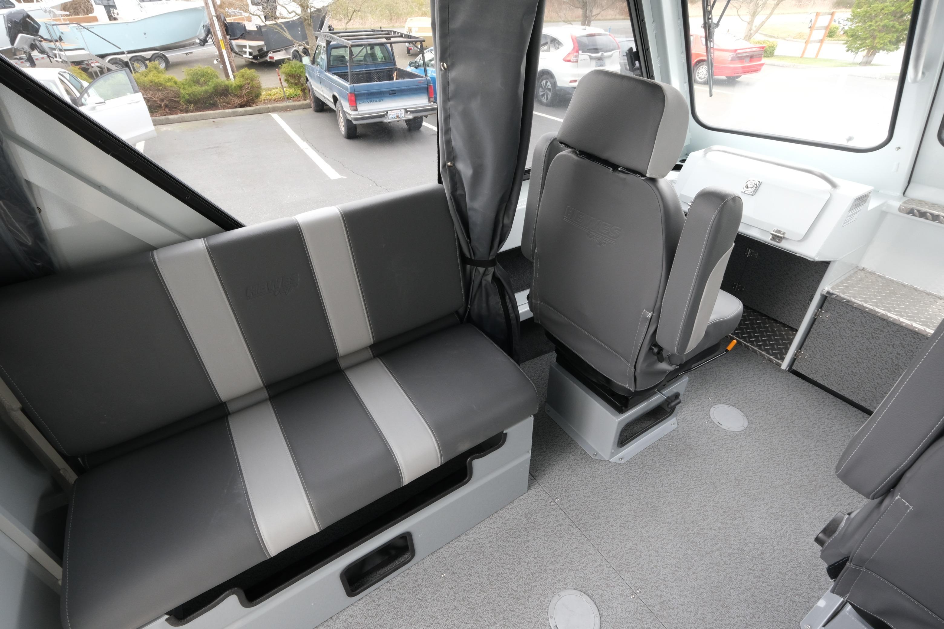 Interior of 2026 Hewescraft 210 Sea Runner ET Hardtop, featuring seating and helm area.