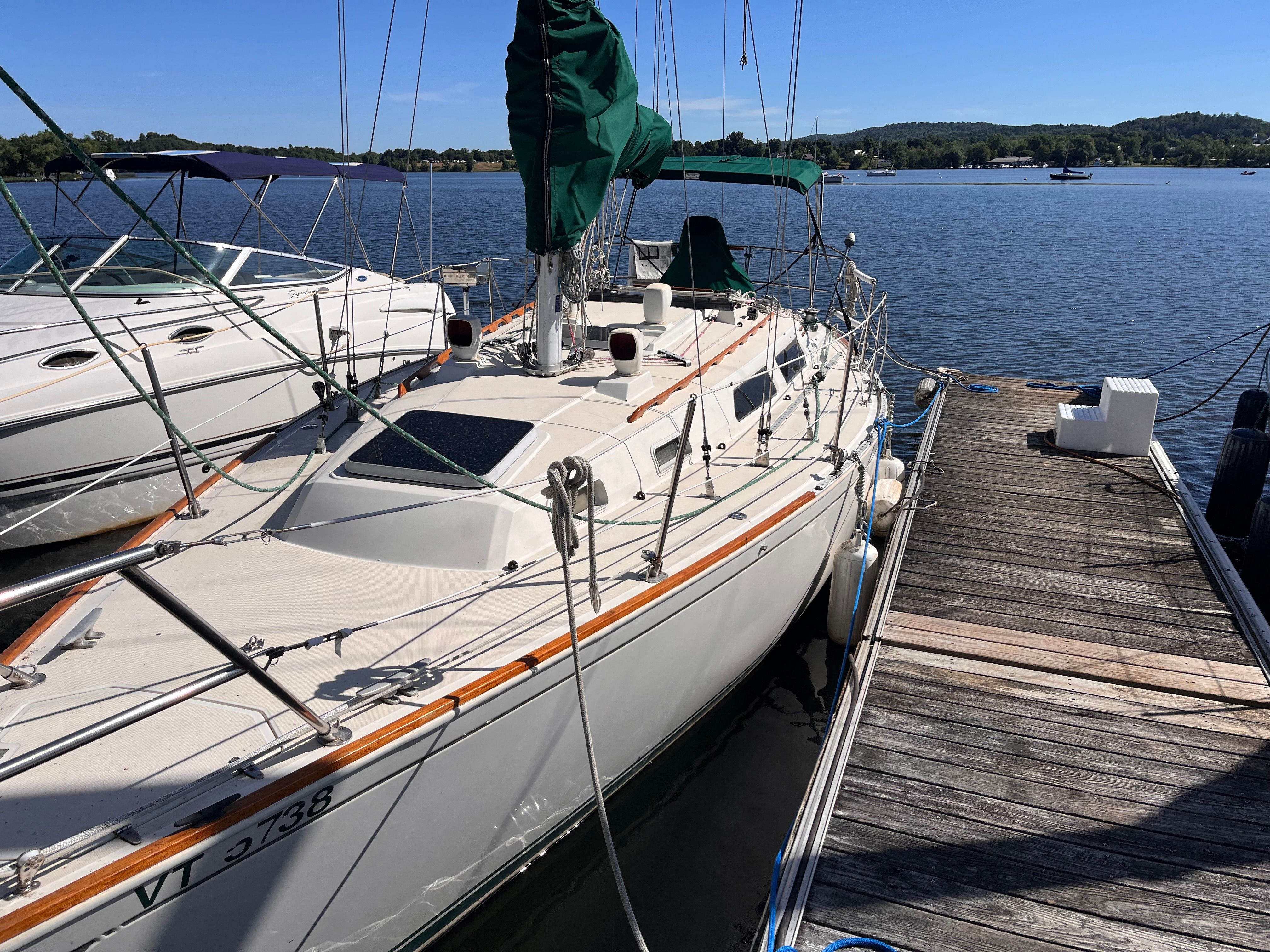 1989 Sabre 30 III sailboat docked by the water.