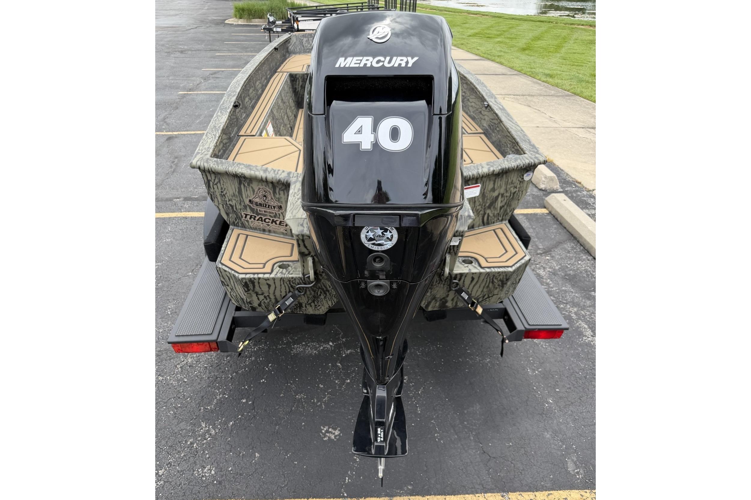 2026 Tracker Grizzly 1650 T Prairie Wings Edition boat with Mercury engine, rear view.