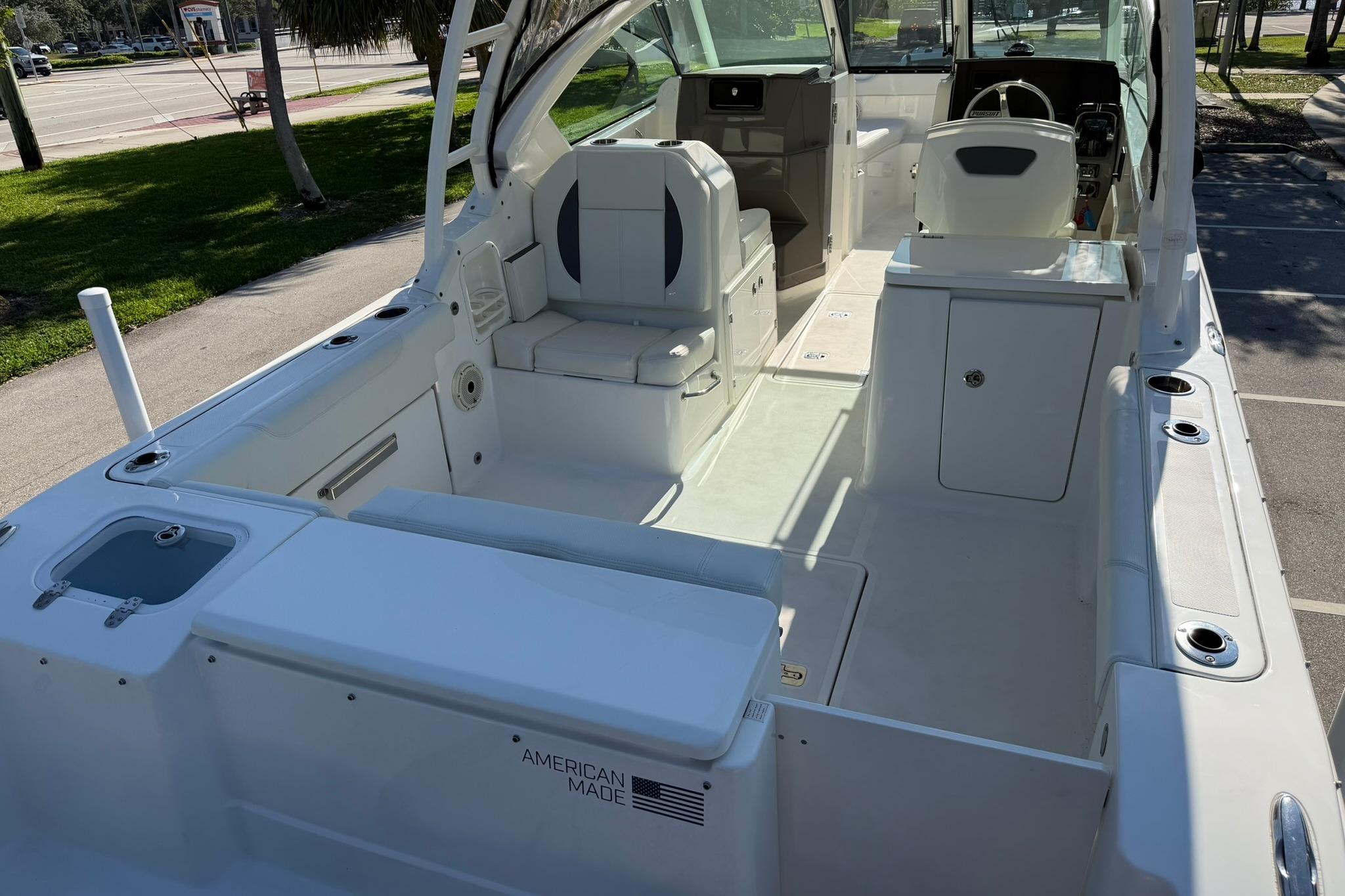 2021 Pursuit DC 266 Dual Console boat interior, showcasing seating and helm area.