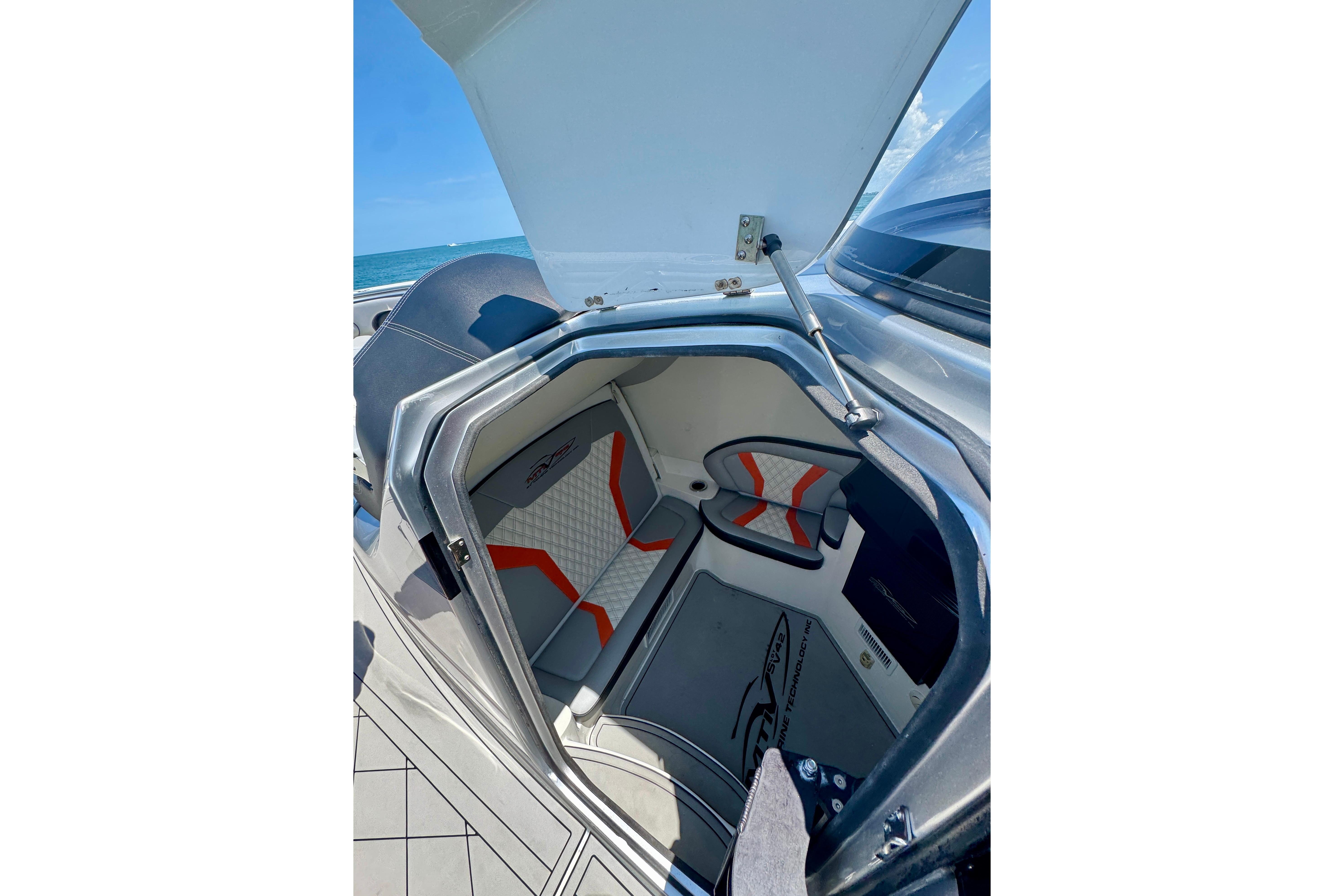 2017 MTI V42 boat cabin interior with modern seating and ocean view.