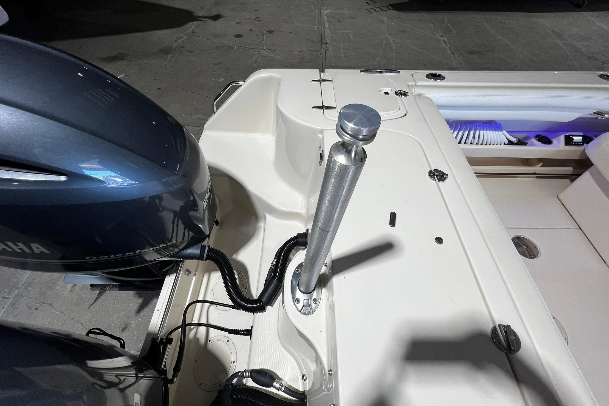2014 Grady-White Freedom 275 boat stern with Yamaha engine and fishing rod holder.