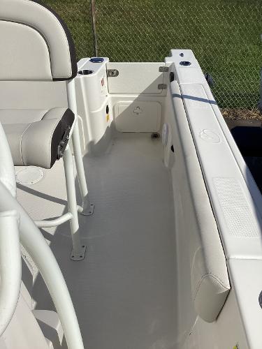 2022 Sailfish 220 CC boat interior with white seating and clean deck.