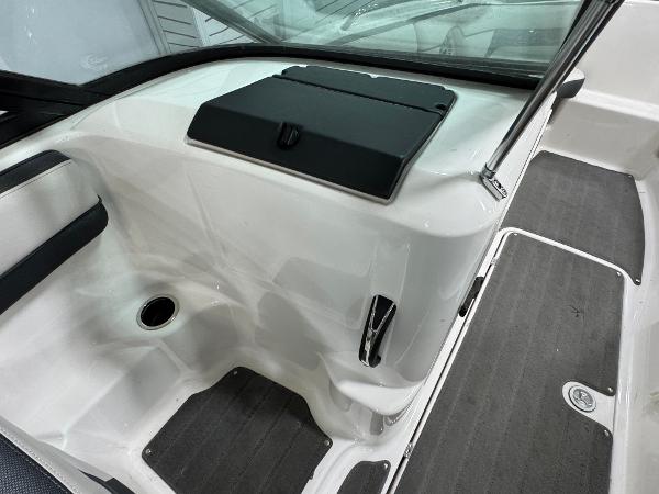 Interior view of a 2014 Yamaha Boats 212X, featuring sleek white and black design elements.