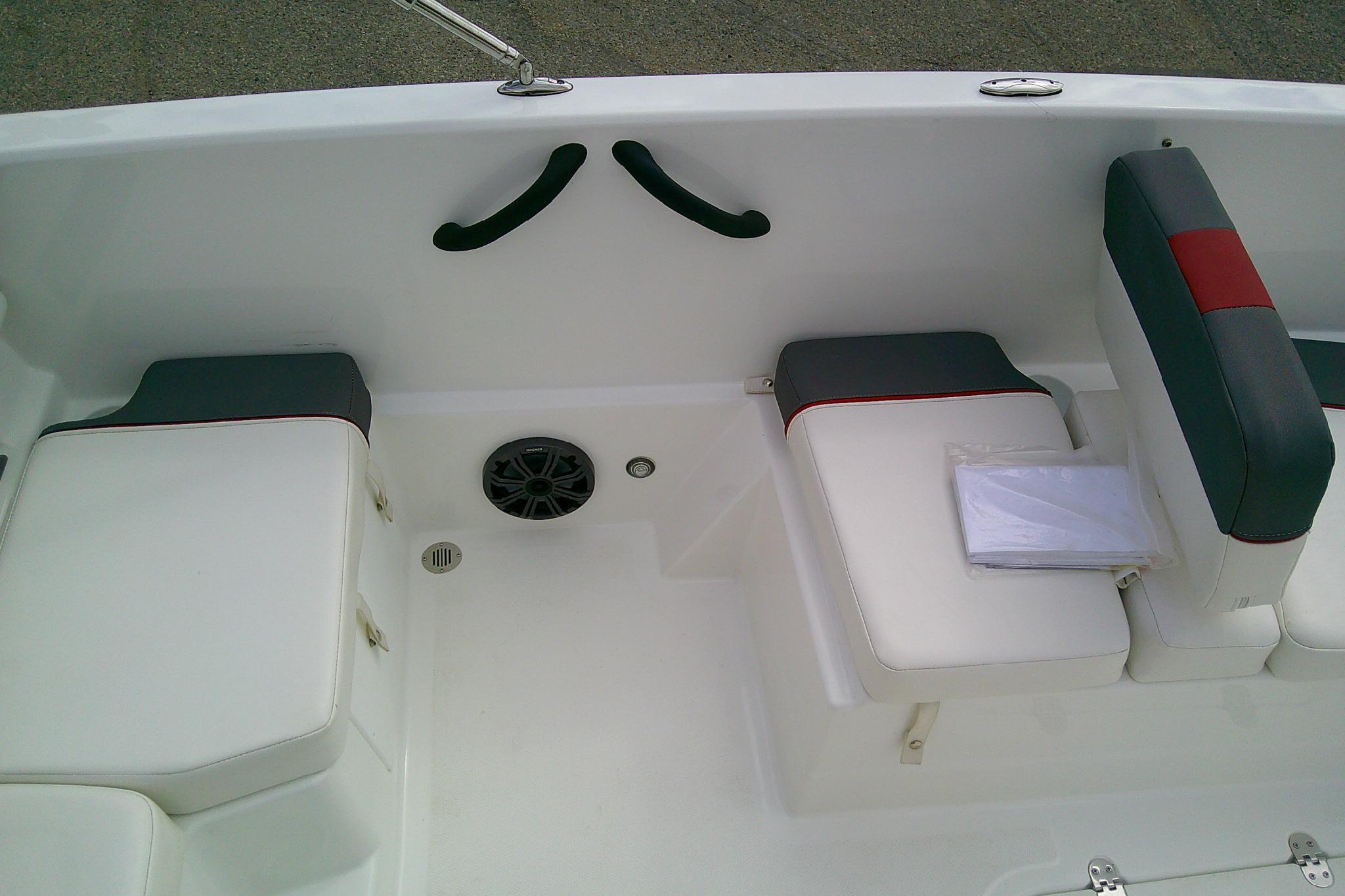 2024 Tahoe T18 boat interior with white and gray seating, featuring red accents.