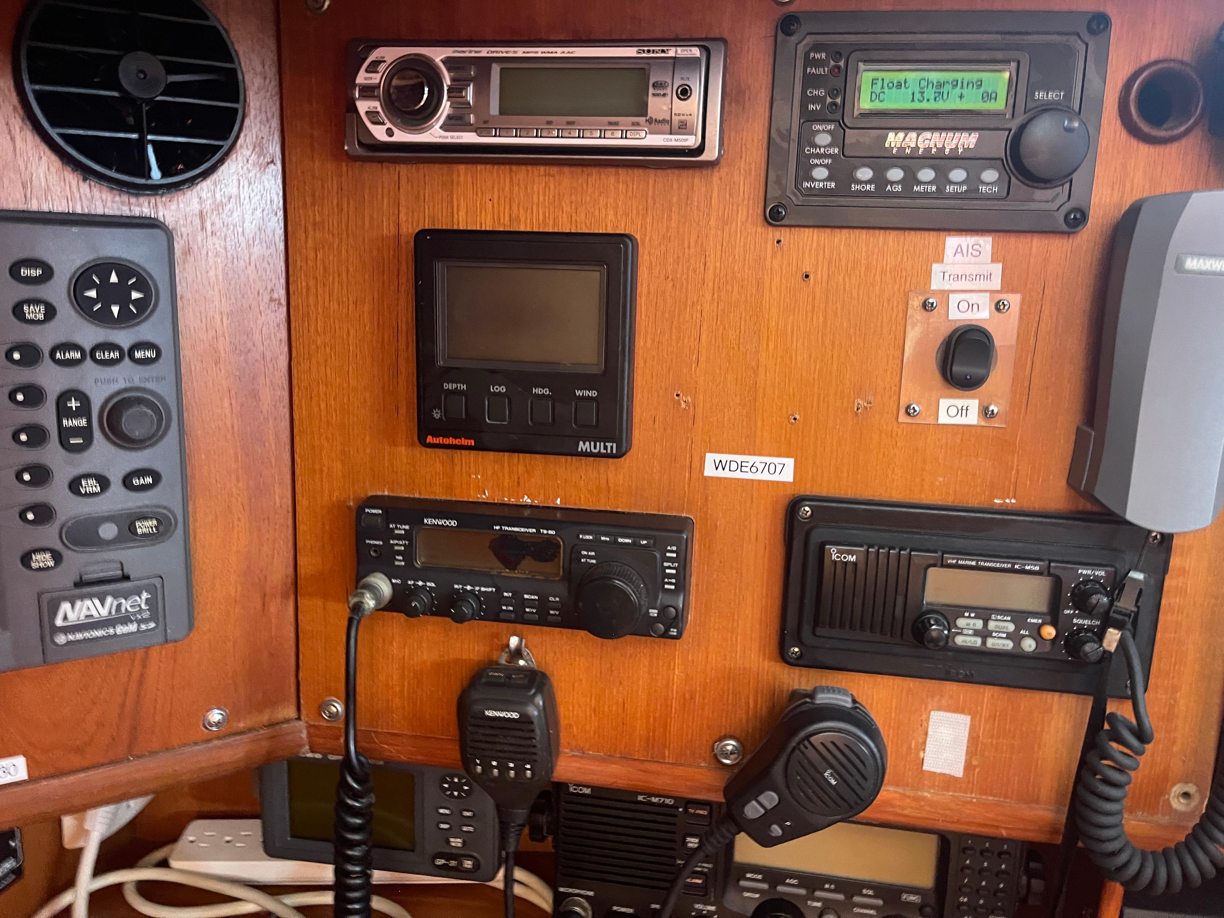 Control panel of a 1995 Passport 47 AC Plan B sailboat with various navigation and communication equipment.